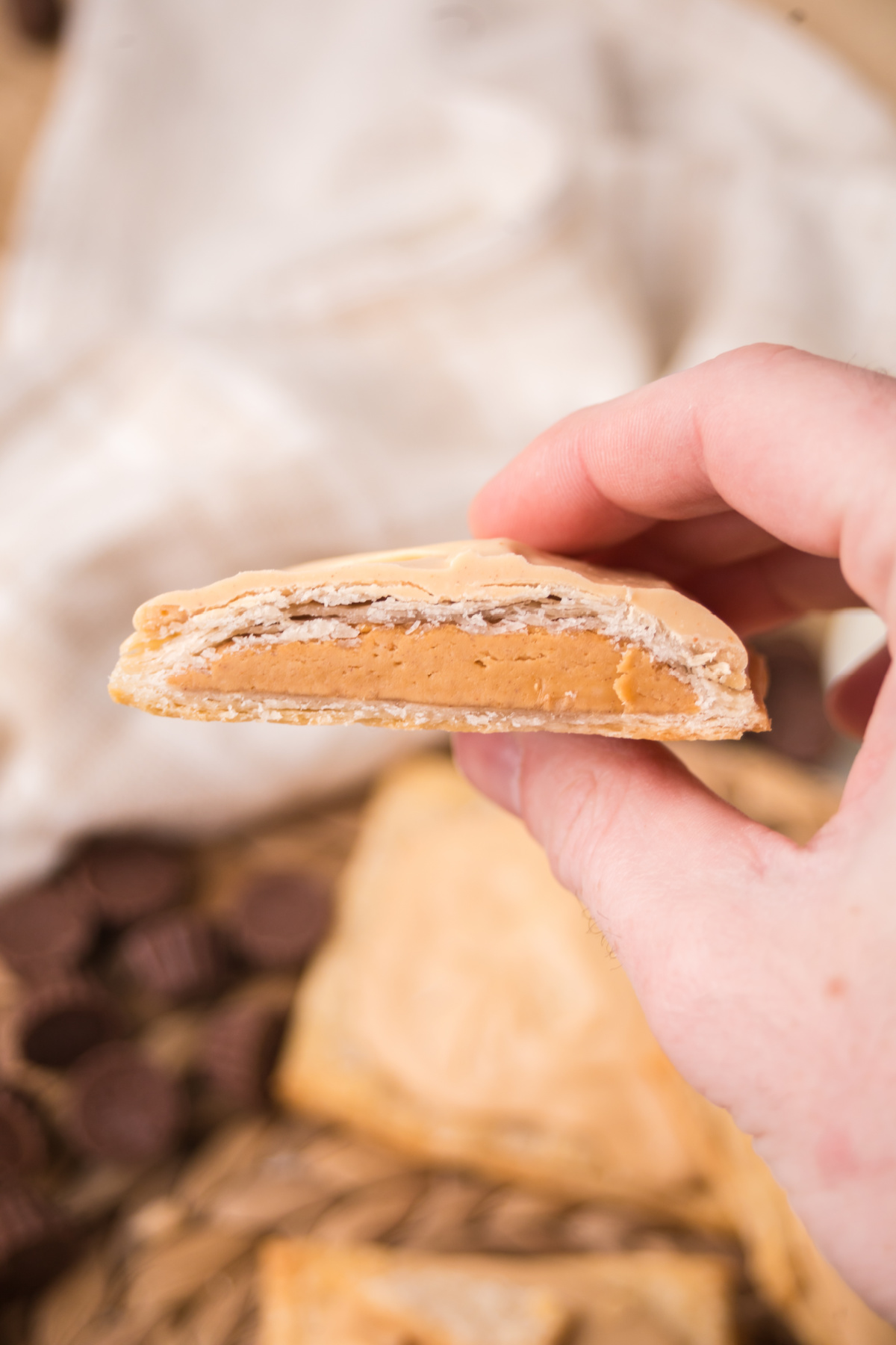 Half a pop tart held in the air.