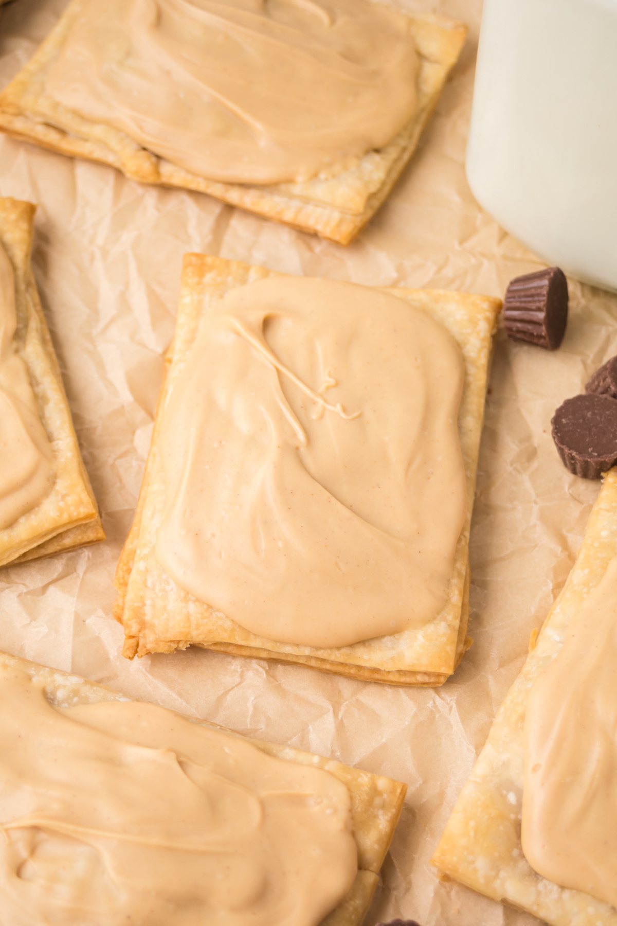 Pop tarts scattered on parchment paper.