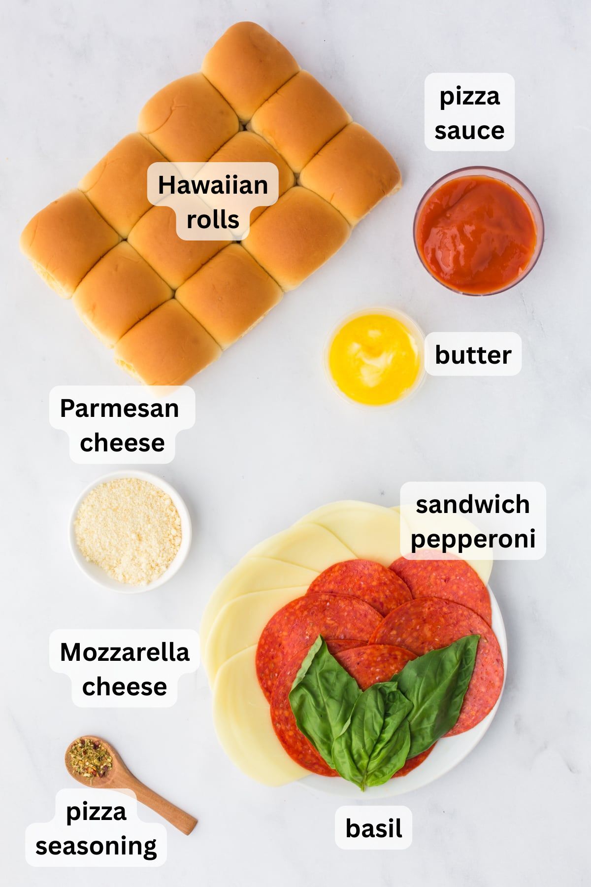 Ingredients needed to make Pizza Sliders in bowls on a table.