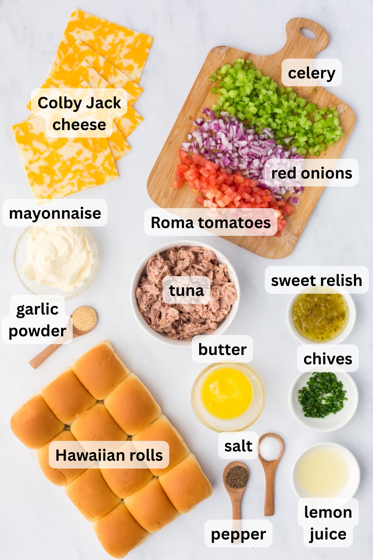 All of the ingredients needed to make tuna melt sliders in bowls on a table.