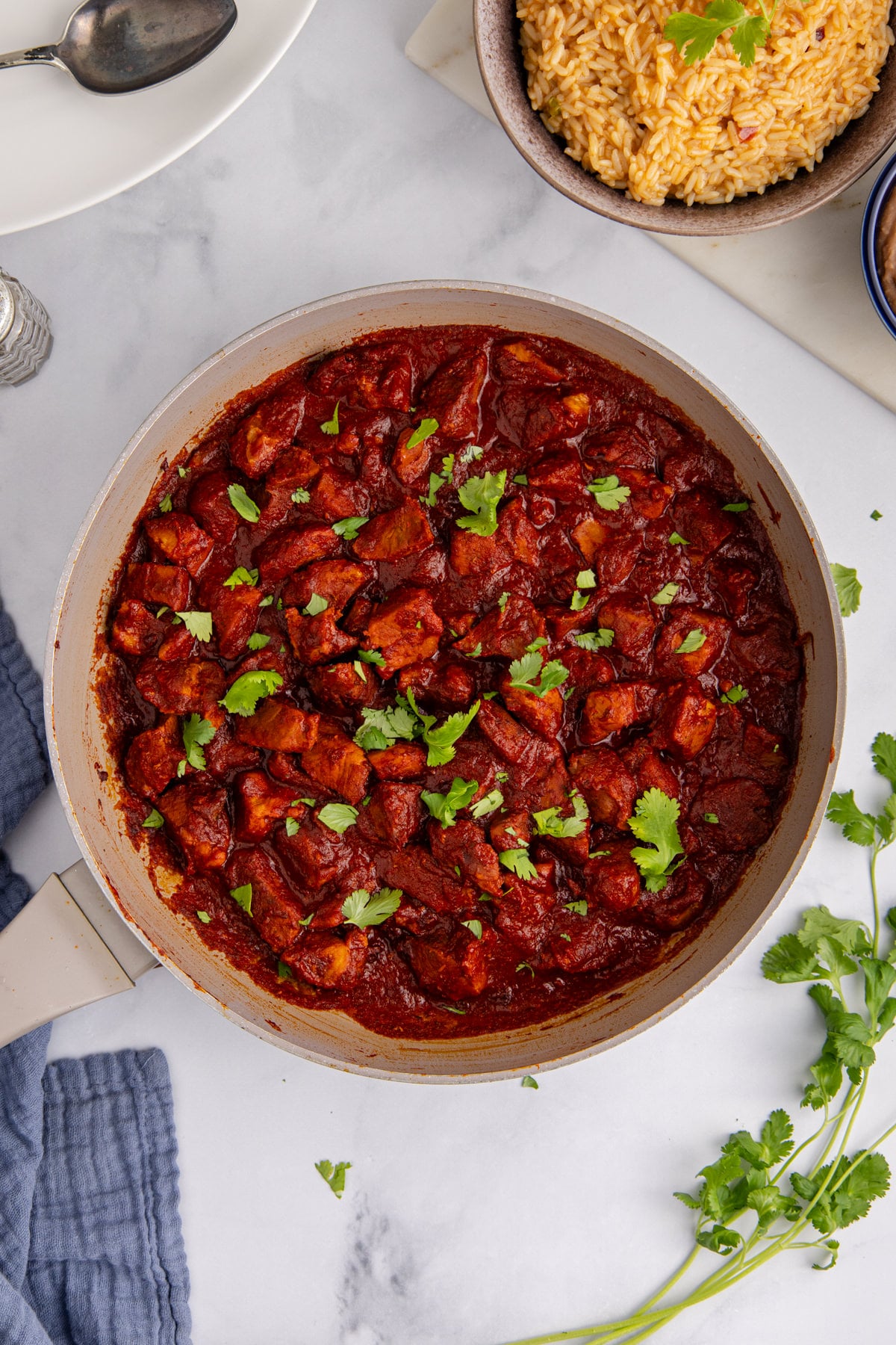 The sauce added to the pork and mixed in.