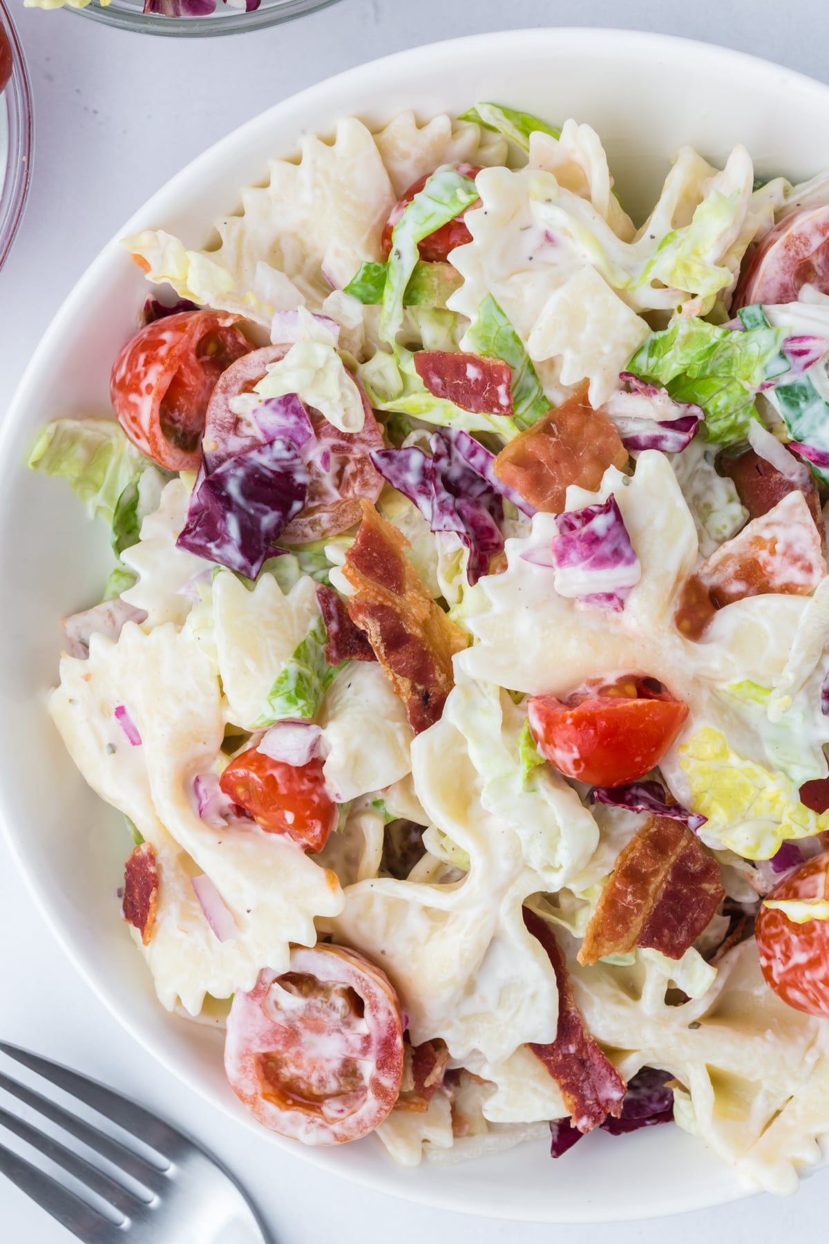 a bowl of pasta salad on a table