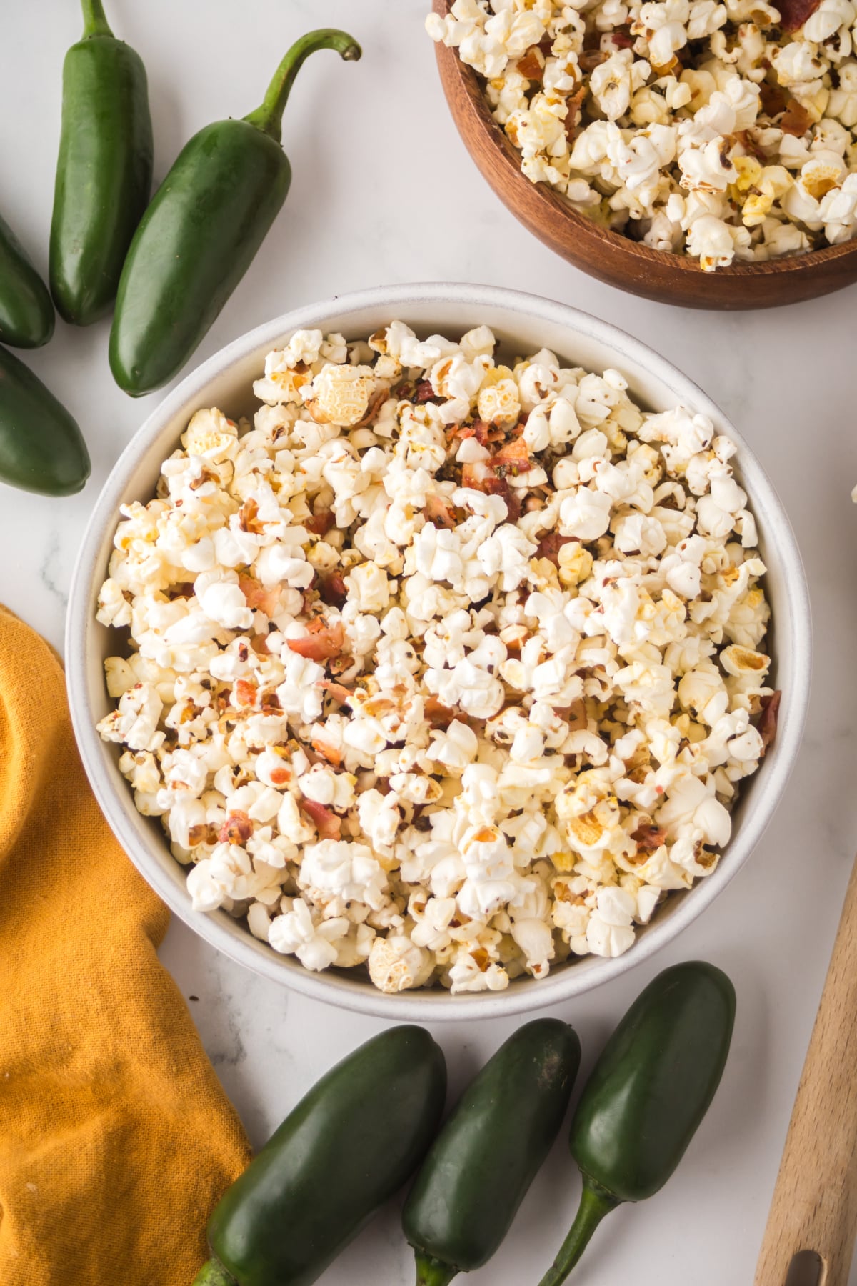 A bowl of popcorn on a table.