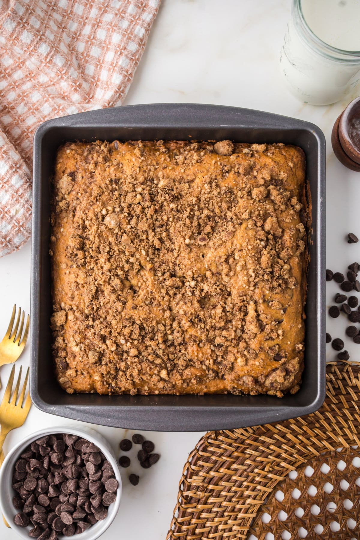 freshly baked banana bread cake with golden crumb topping cooling in pan