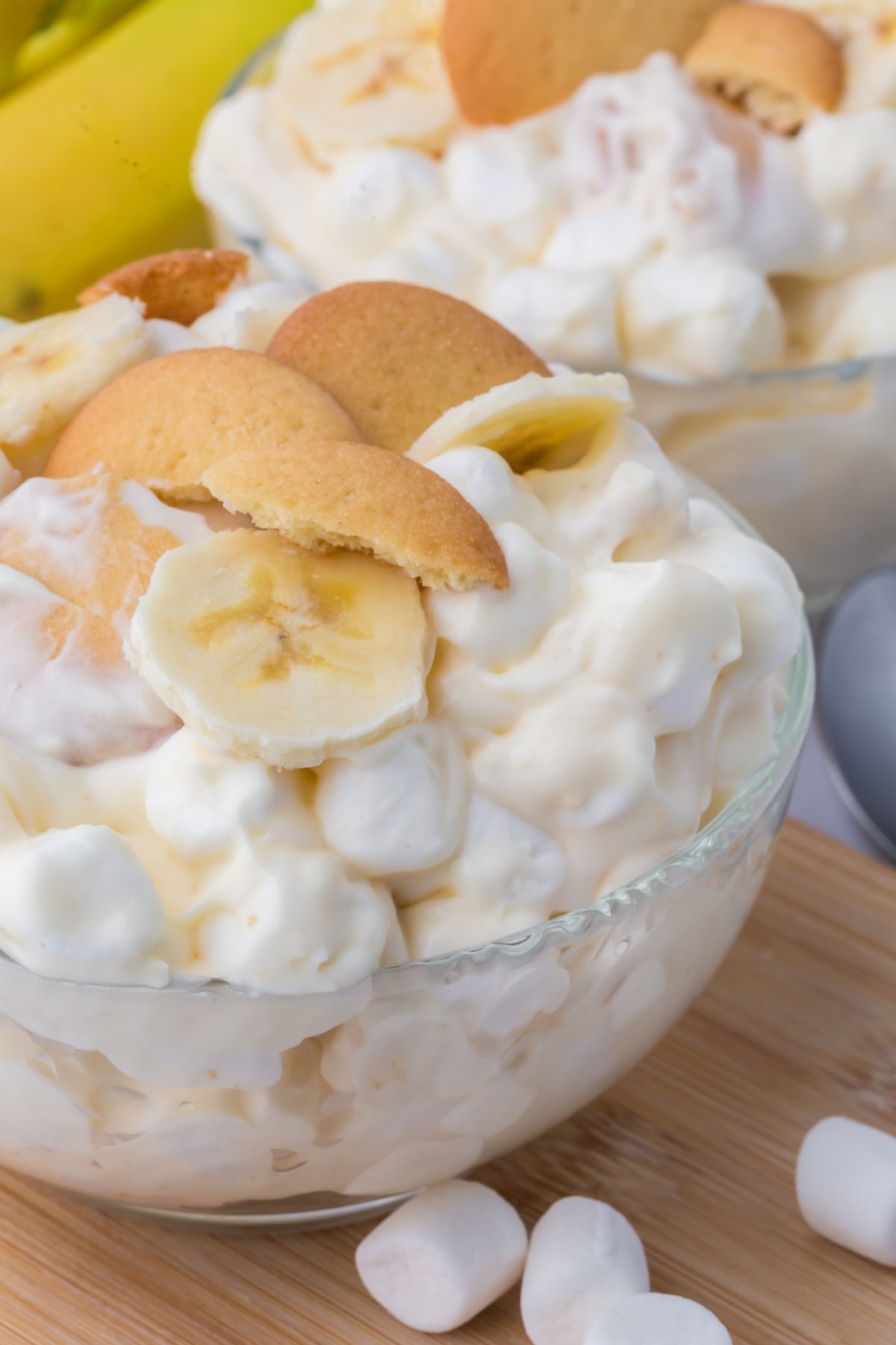 banana pudding fluff dessert served in bowl topped with wafers and banana slices