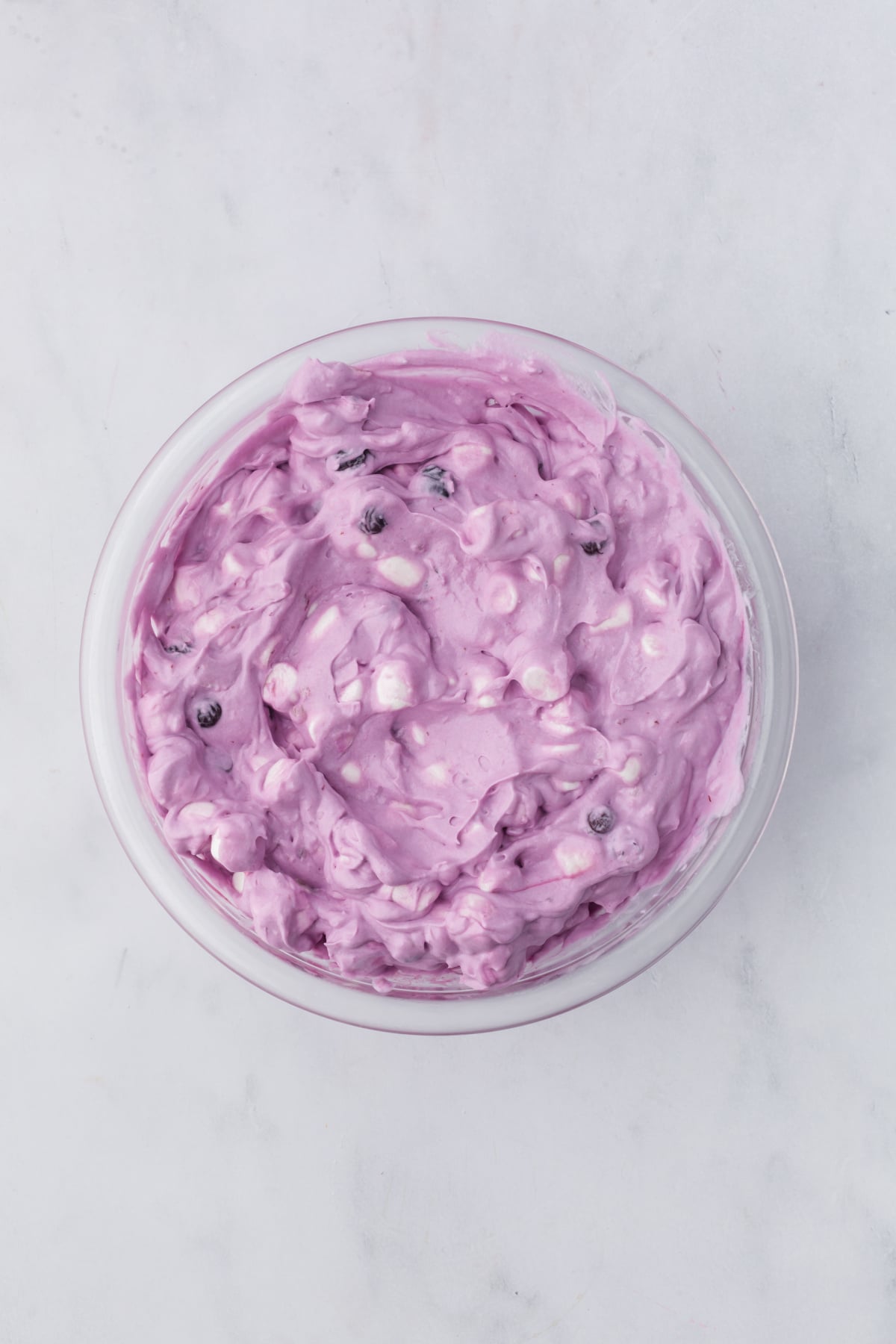 blueberry fluff ready to serve with marshmallows and fresh blueberries on top