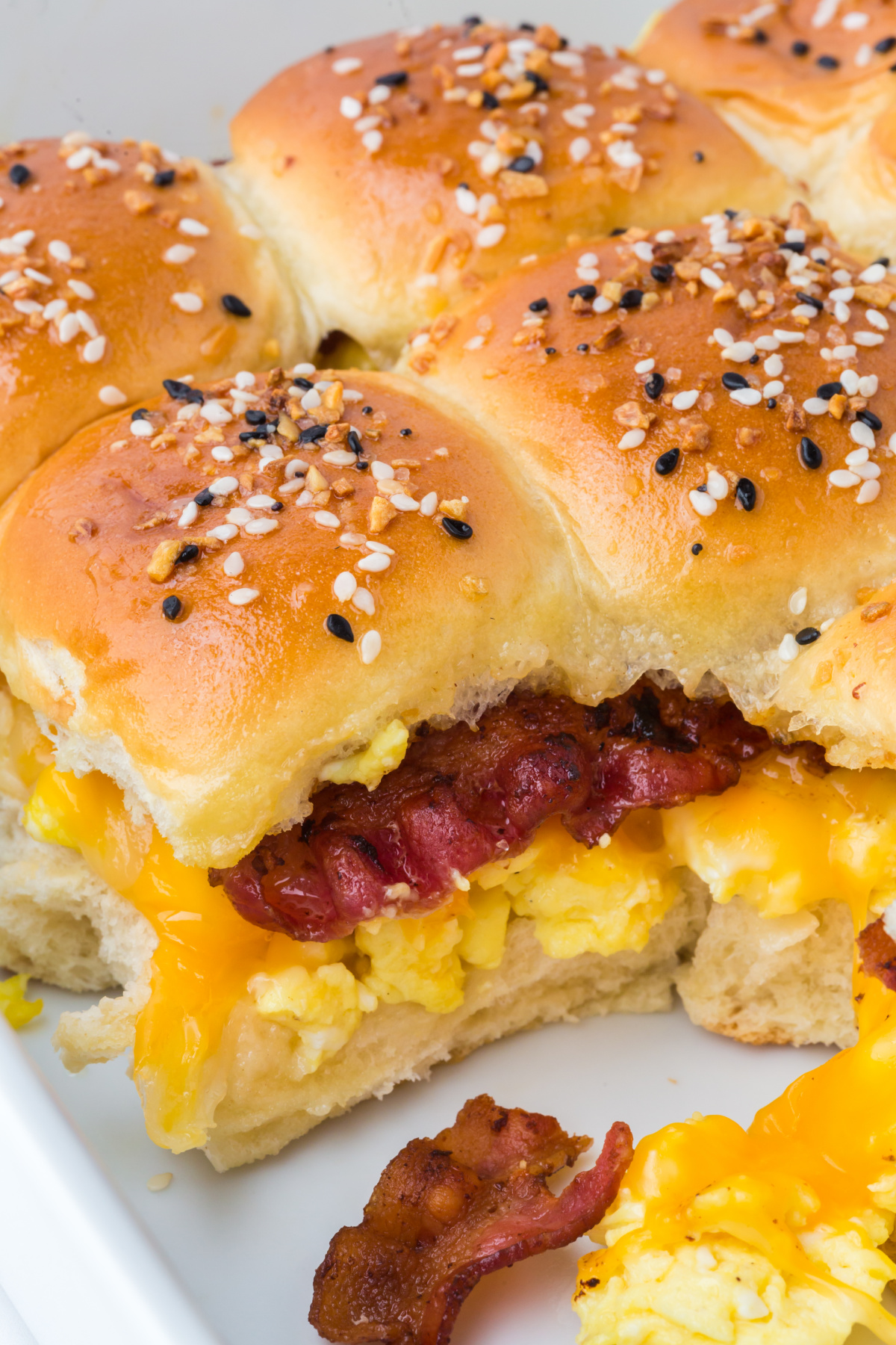 baked breakfast sliders served warm in pan with one missing