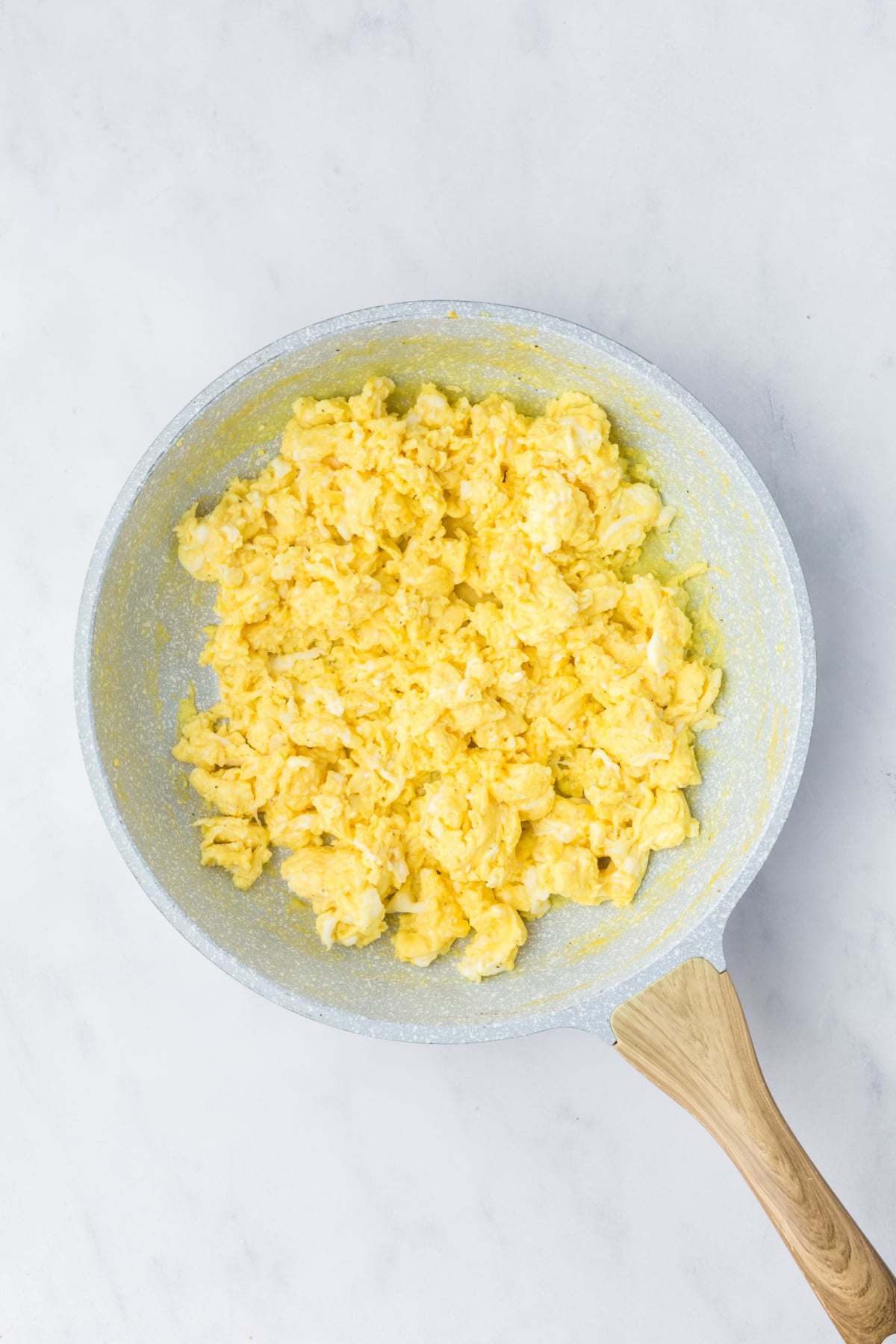 scrambling eggs in skillet for breakfast sliders recipe