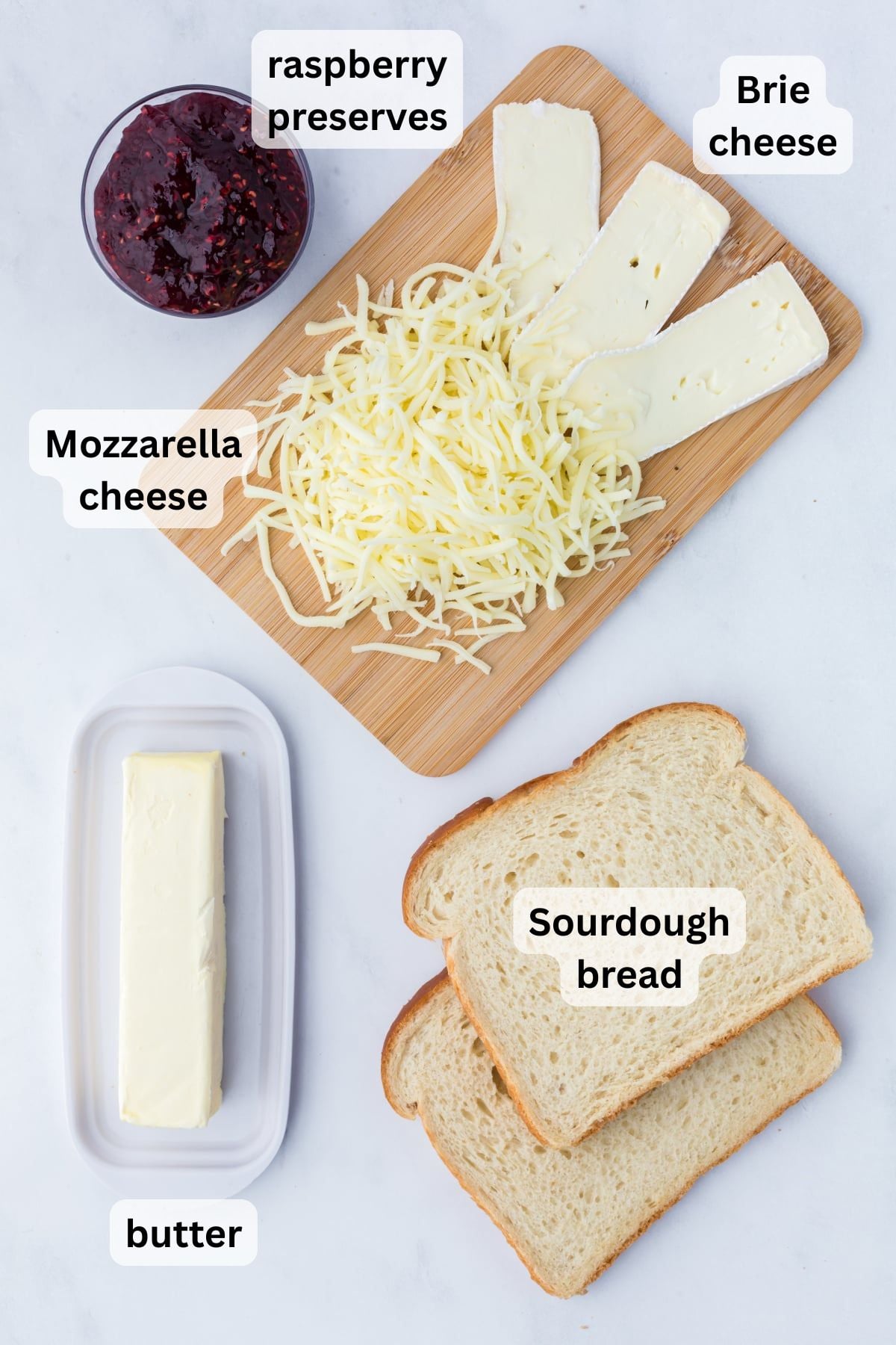 All the ingredients needed to make Brie Grilled Cheese in bowls on a table