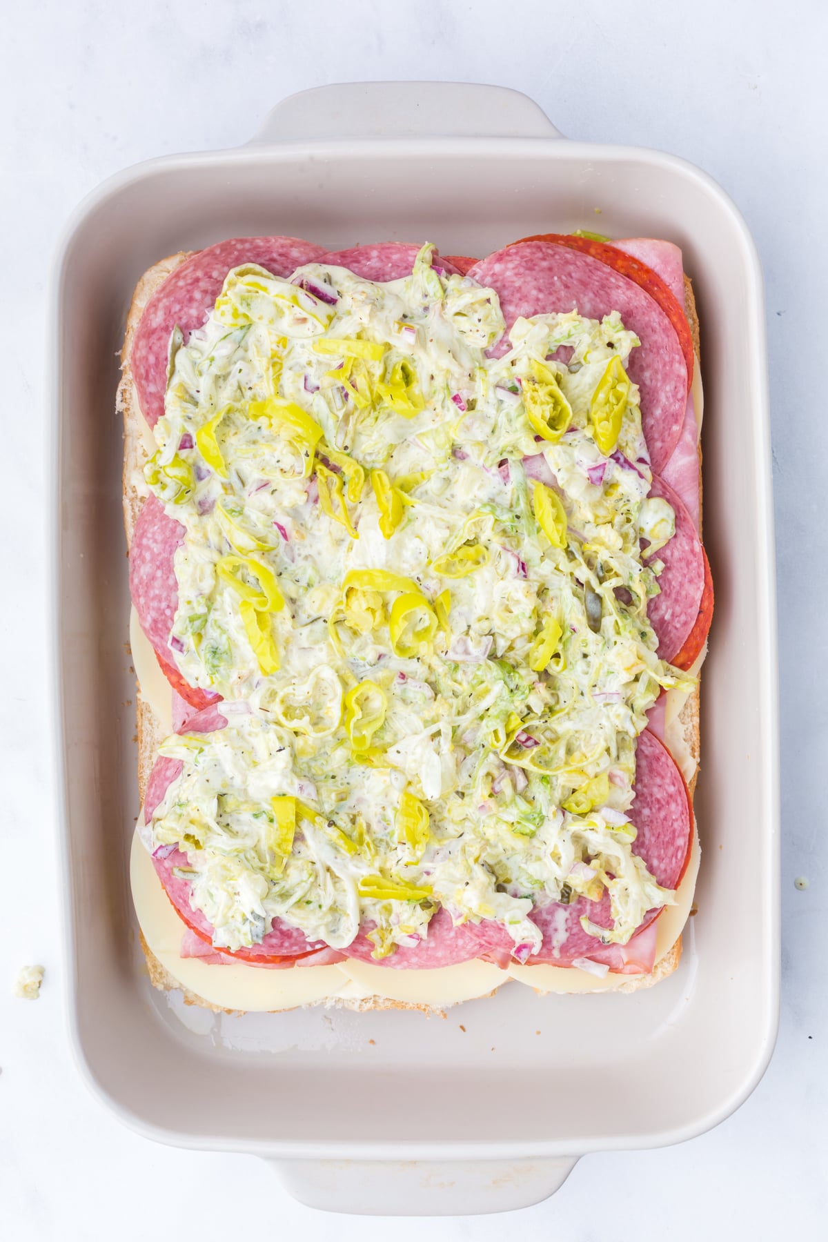 Sliders layered in baking dish
