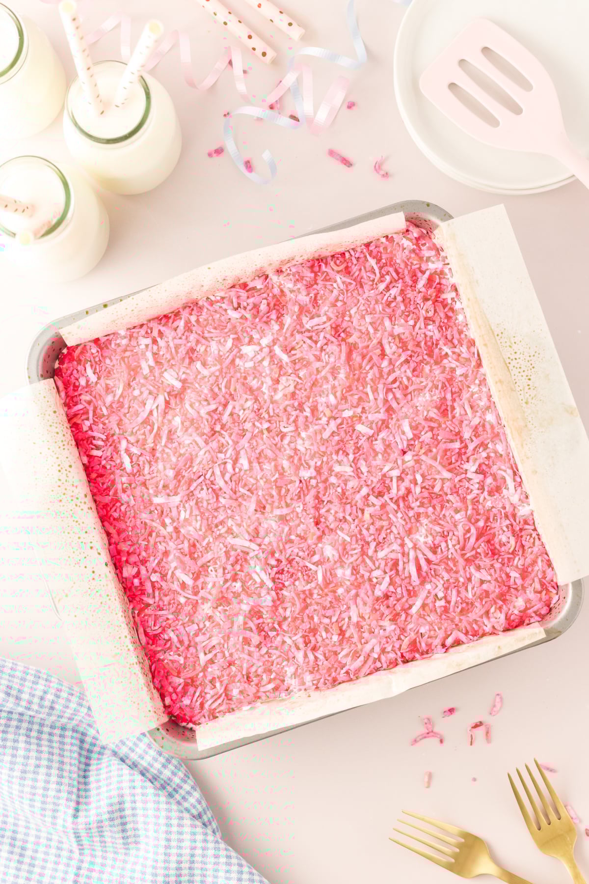 Coconut mixture lightly pressed into melty marshmallow fluff.