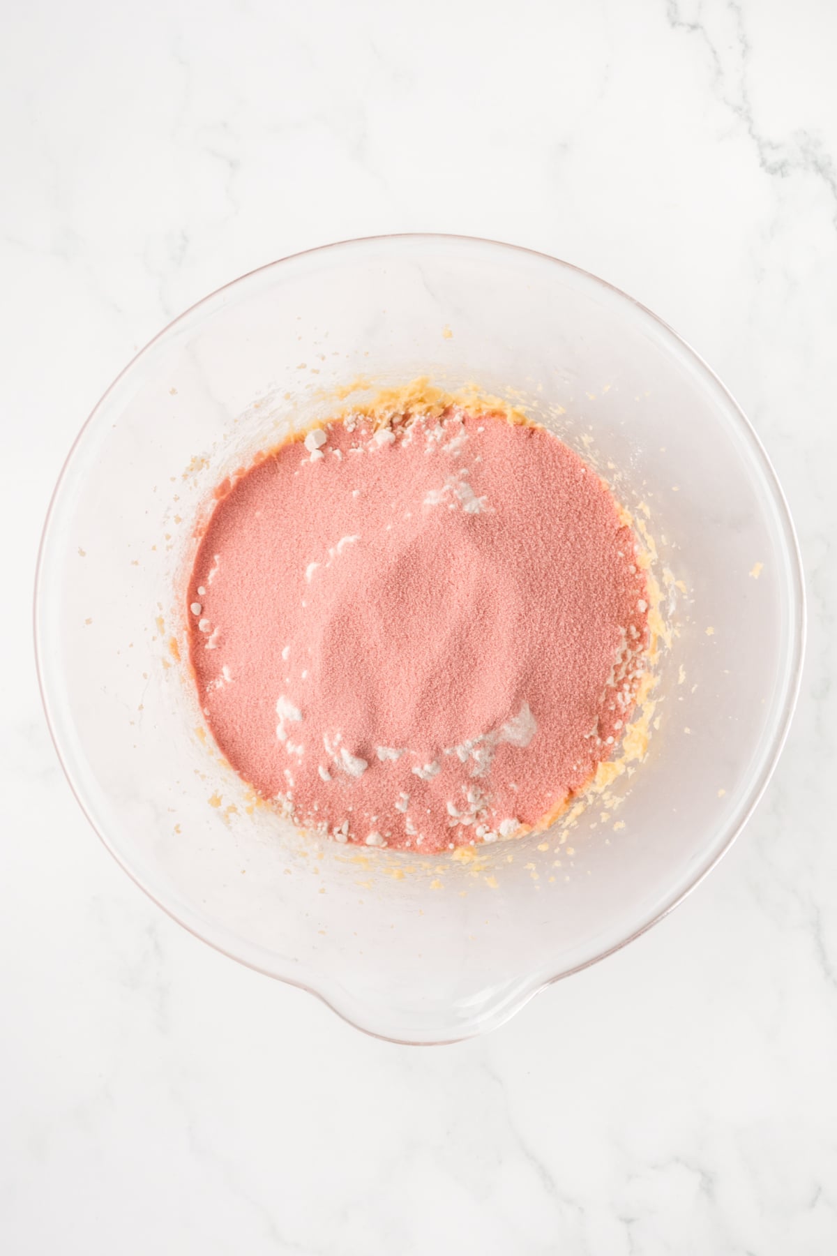 mixing flour and strawberry jello into cookie dough