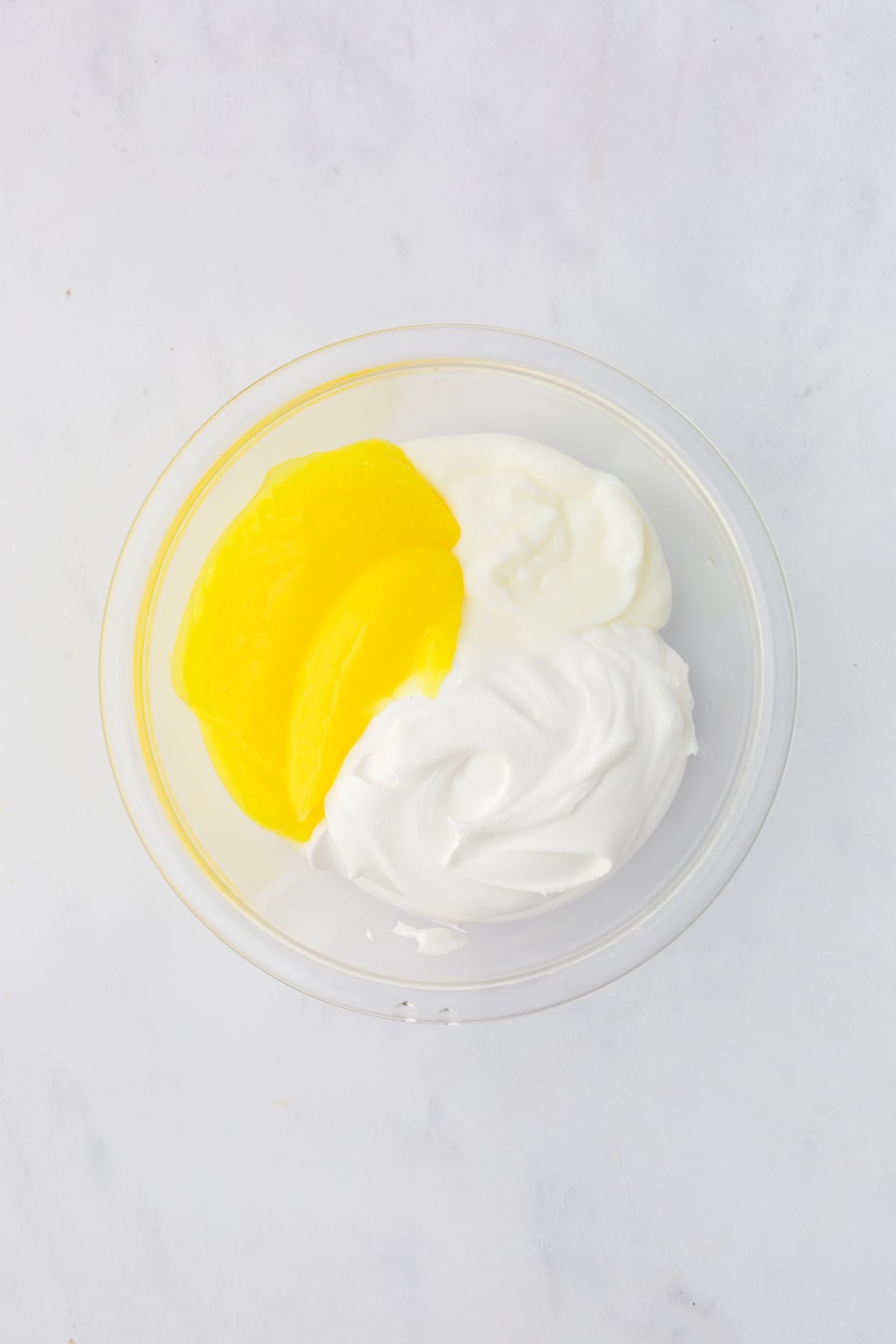 whipped topping, yogurt, and lemon filling in a bowl