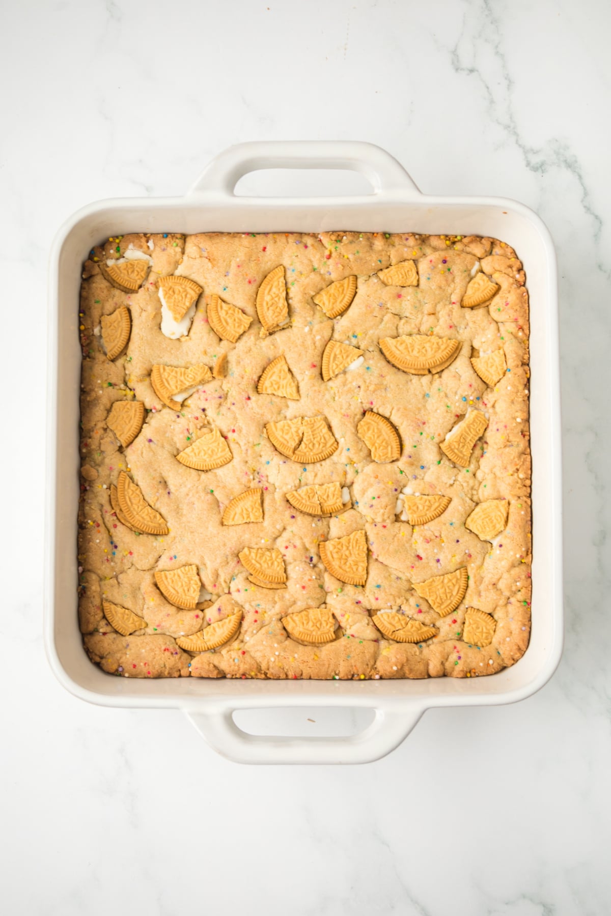 oreo cookie bars baking in oven until golden