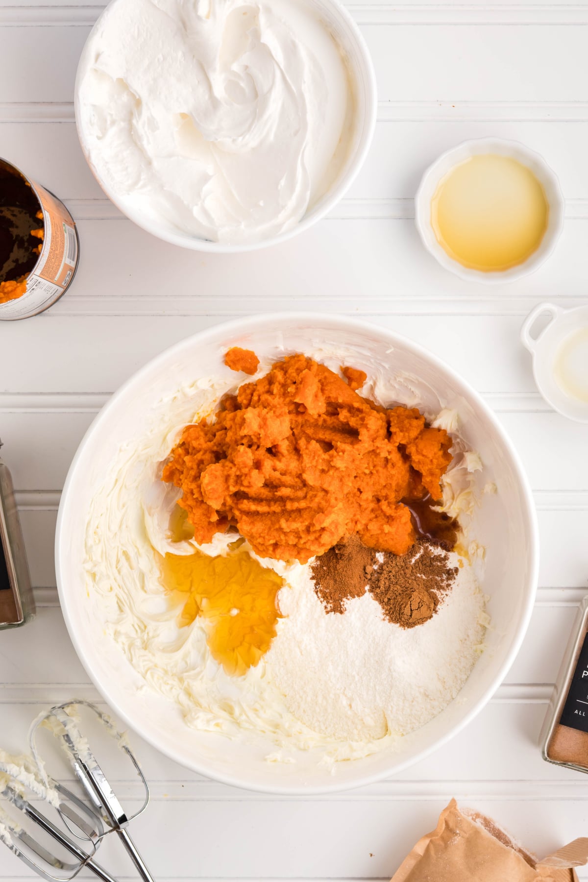Pumpkin puree, pudding mix, spices, vanilla, and syrup added to the cream cheese mixture.
