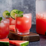 Watermelon agua fresca with a lime and mint on top.