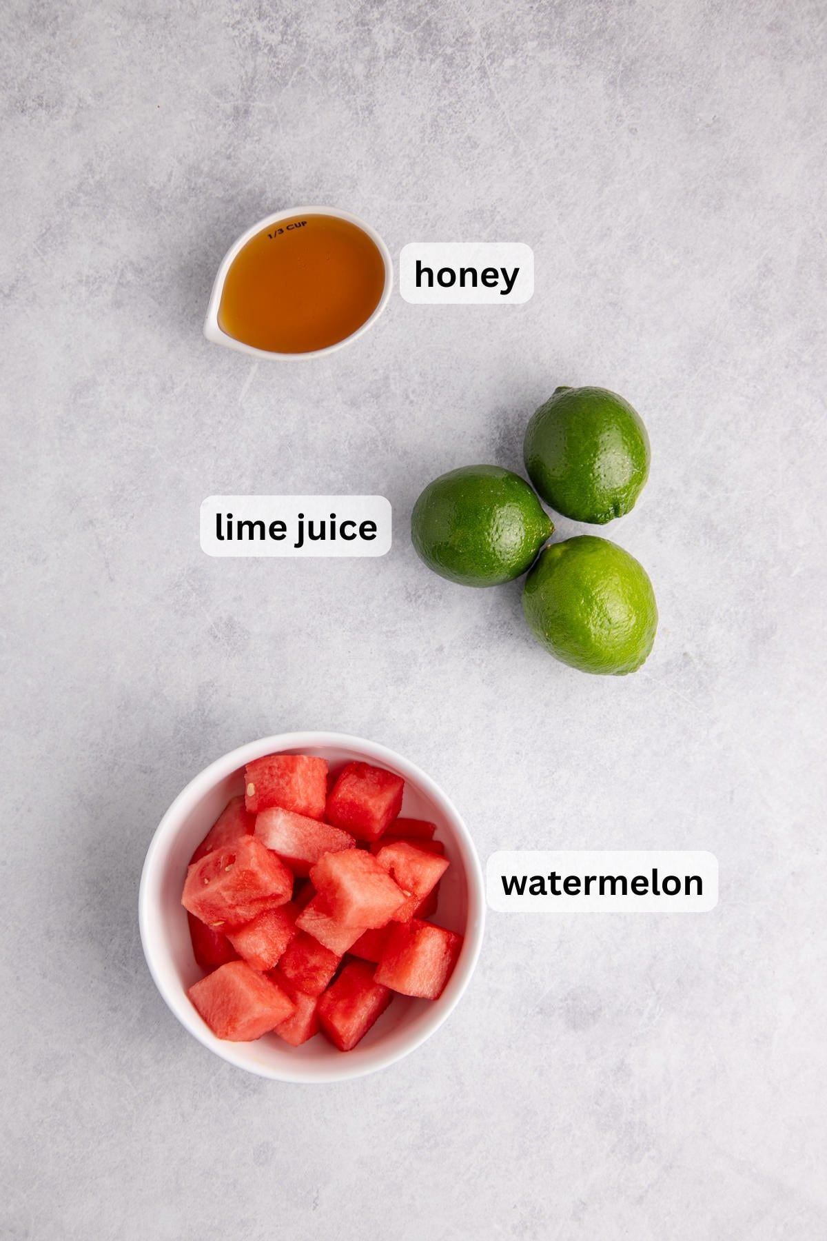 All the ingredients needed to make Watermelon Agua de Fresca in bowls on a table.