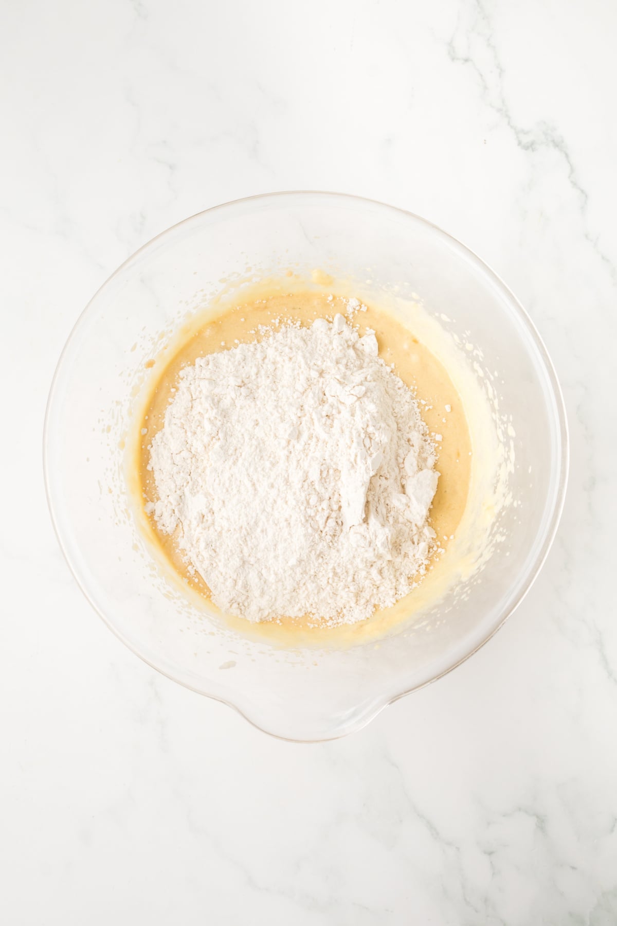 dry ingredients added to mixing bowl with wet ingredients