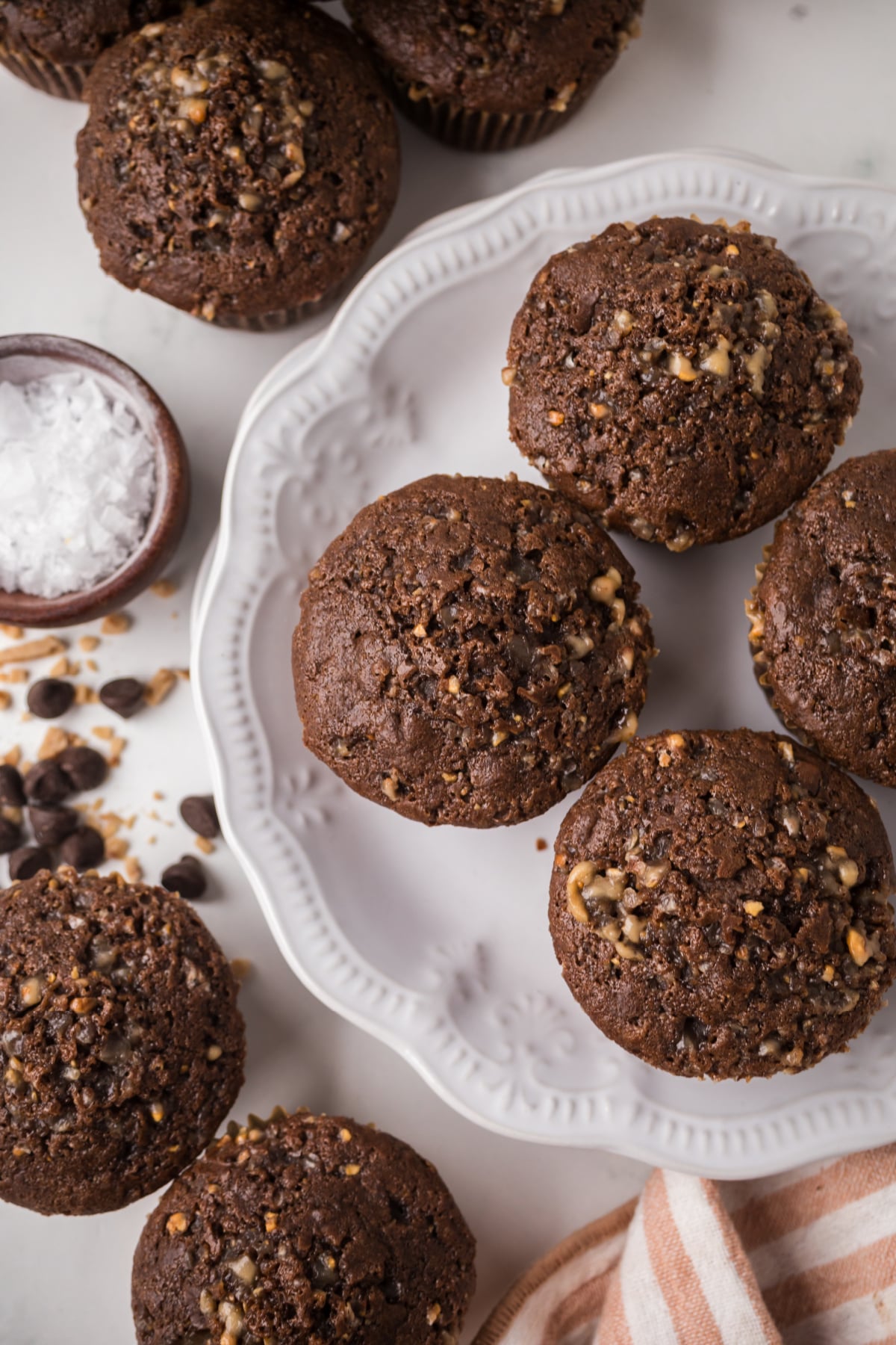 double chocolate chip muffins on plate and on table