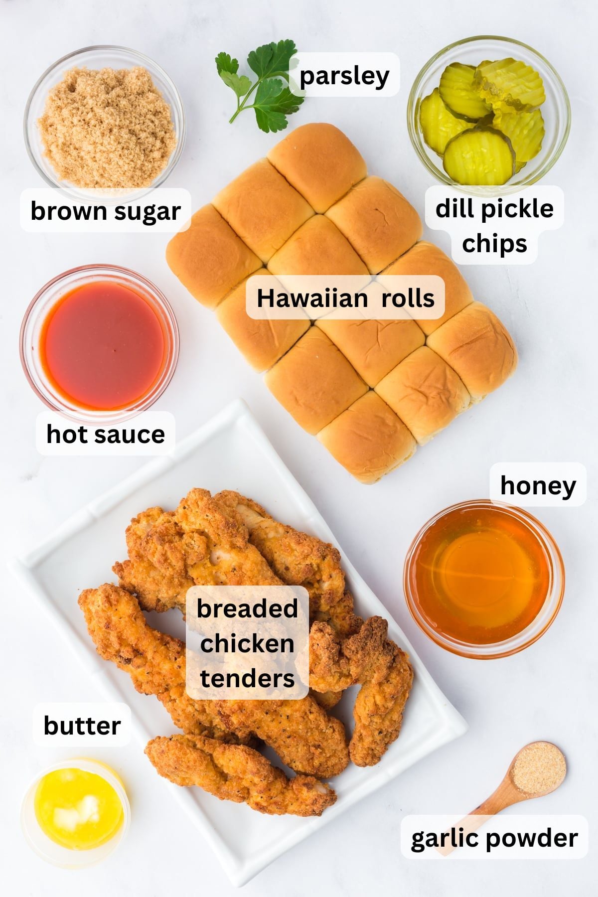 All the ingredients needed to make Hot Honey Chicken Sliders in bowls on a table.