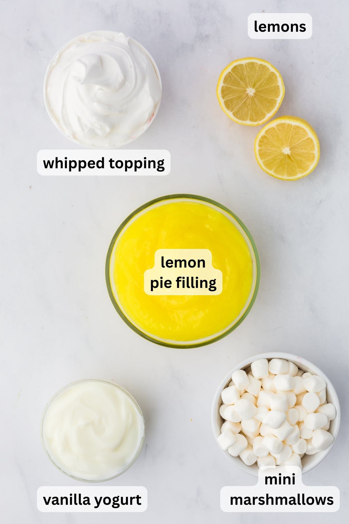 All the ingredients needed to make Lemon Fluff in bowls on a table