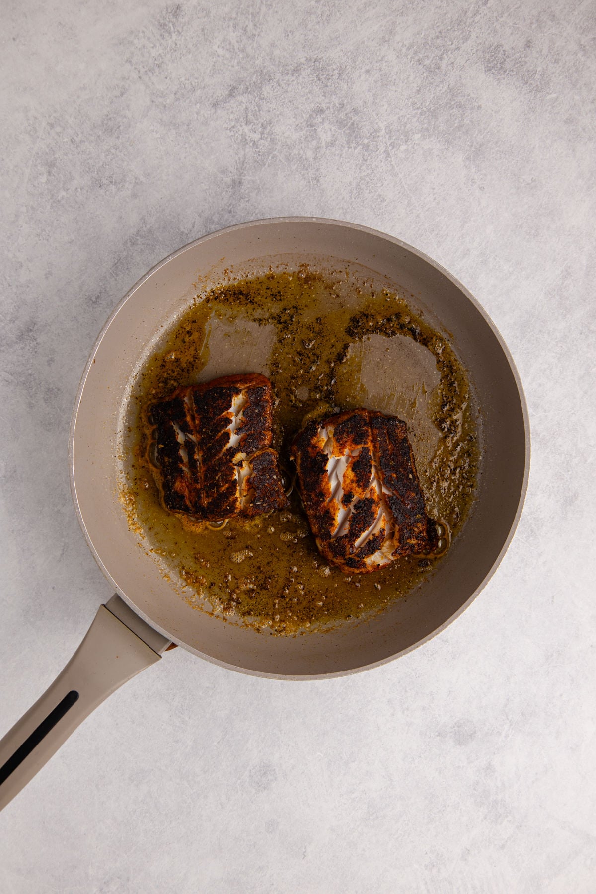 The cod flipped to cook on the other side.