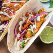 Blackened fish tacos on a cutting board.