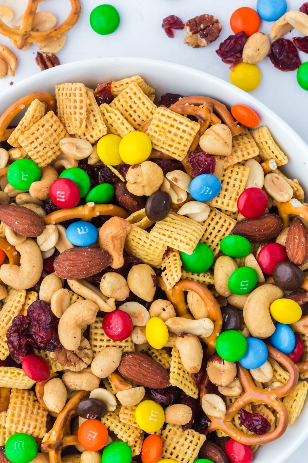 A bowl full of trail mix on table