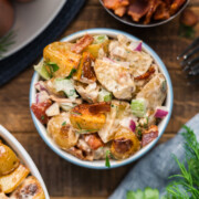 A bowl of Crispy Potato Salad on a table.
