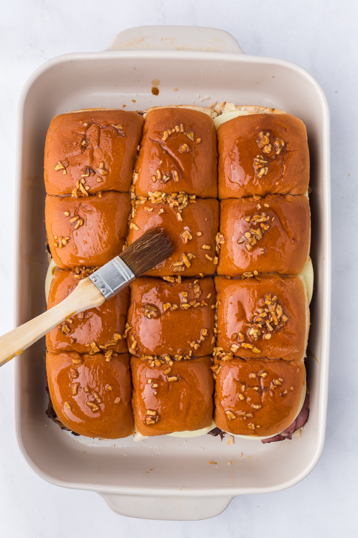 Butter and onion soup mix brushed on top of buns.