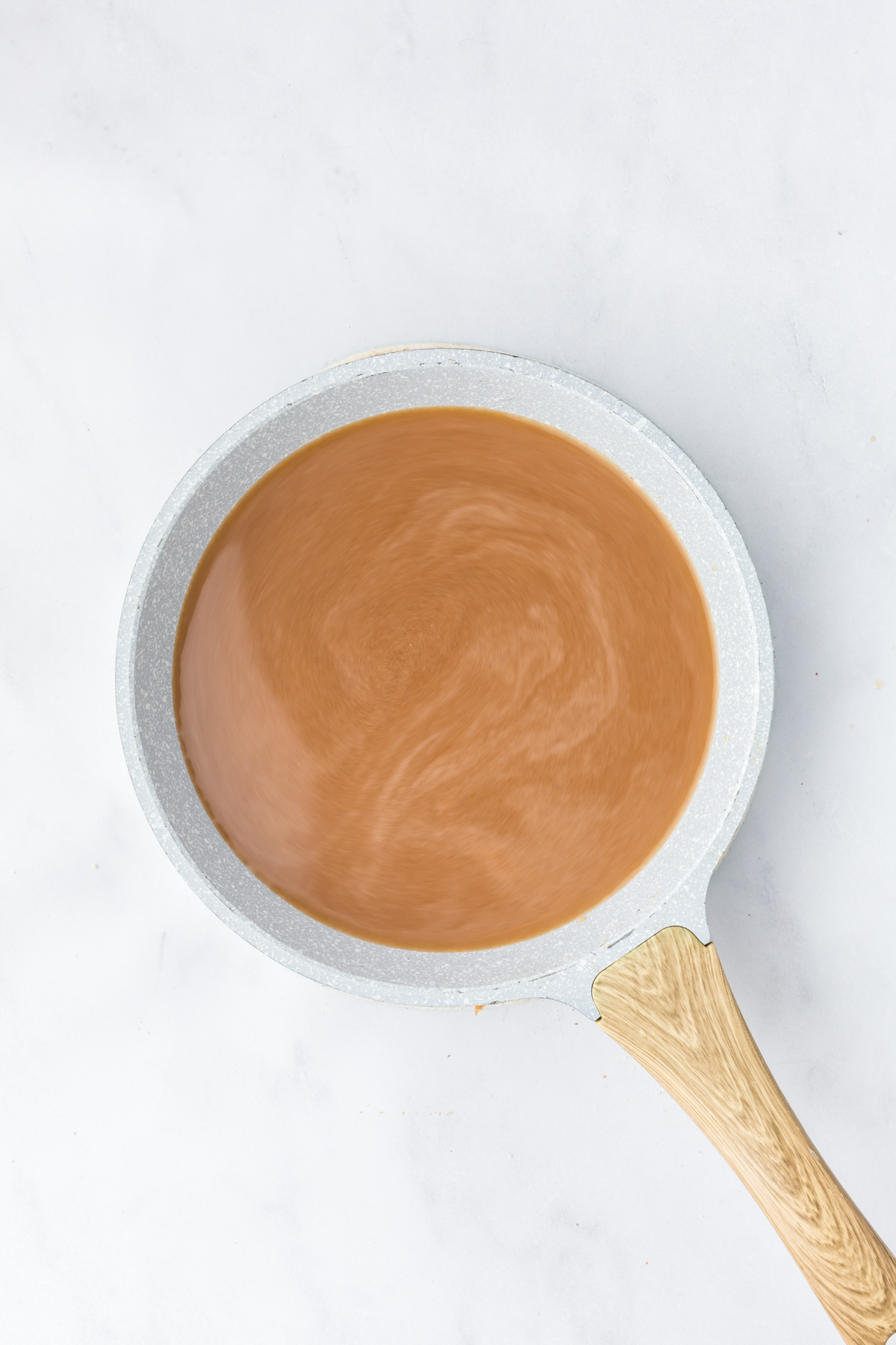 A saucepan full of au jus.