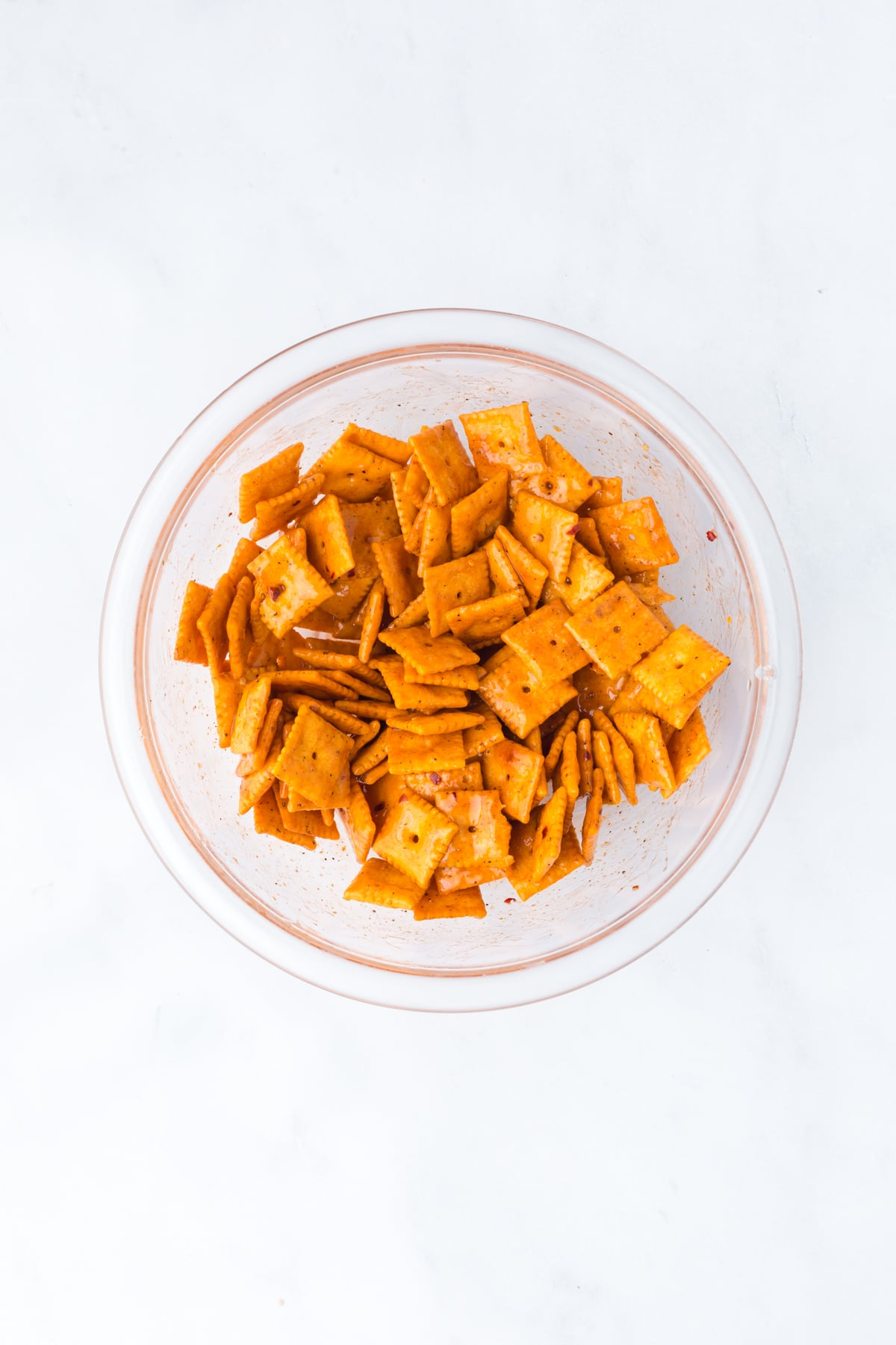 Tossed Cheez-Its in mixture until fully coated in bowl.