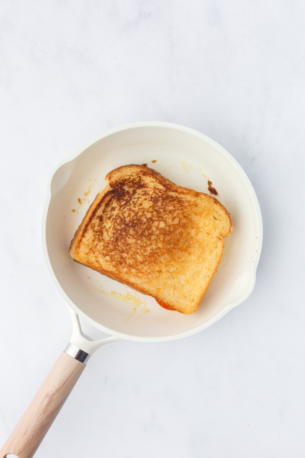 Cooked sandwich in skillet