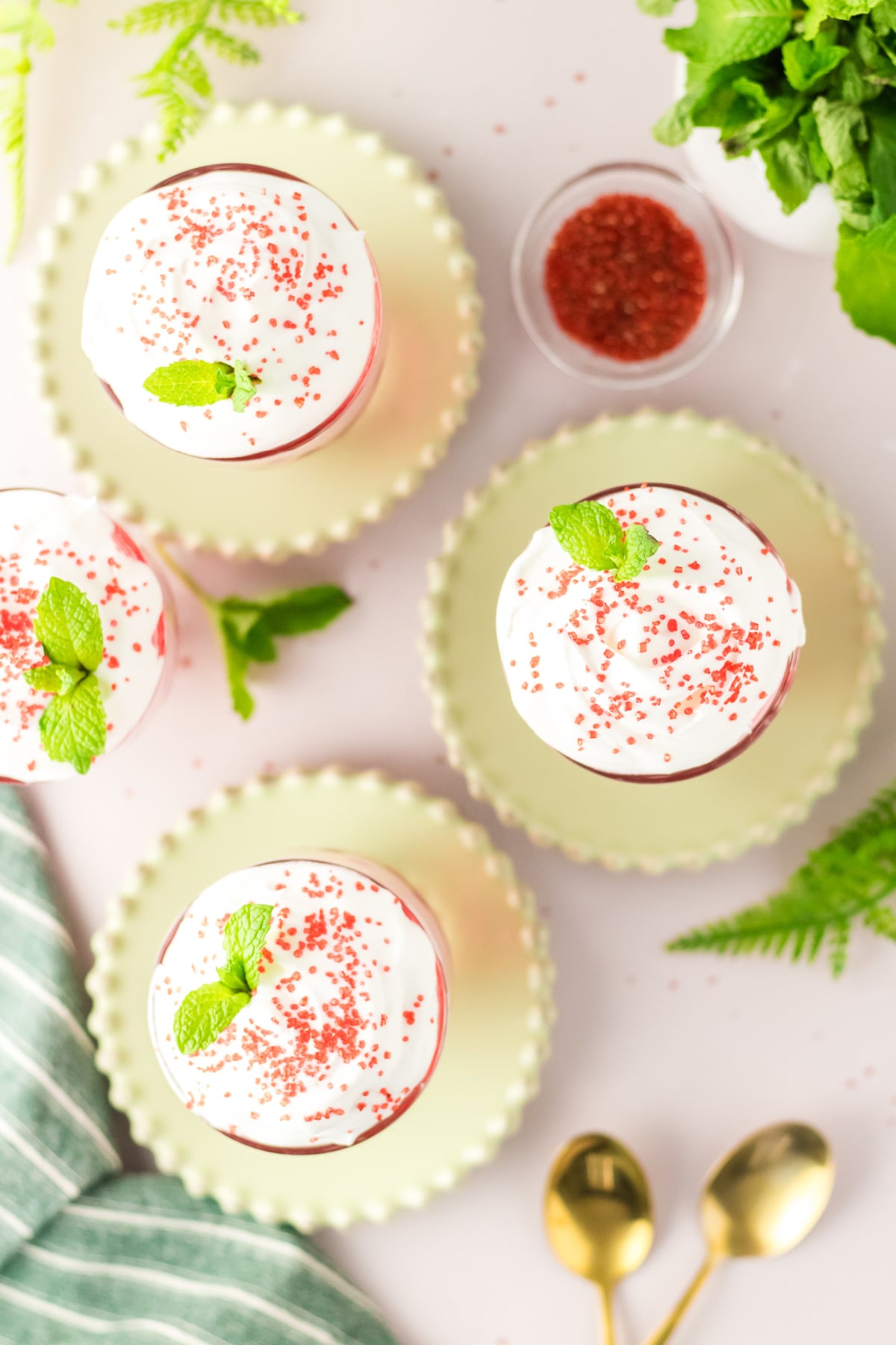 Whipped topping, sprinkles and mint added to top of each glass.