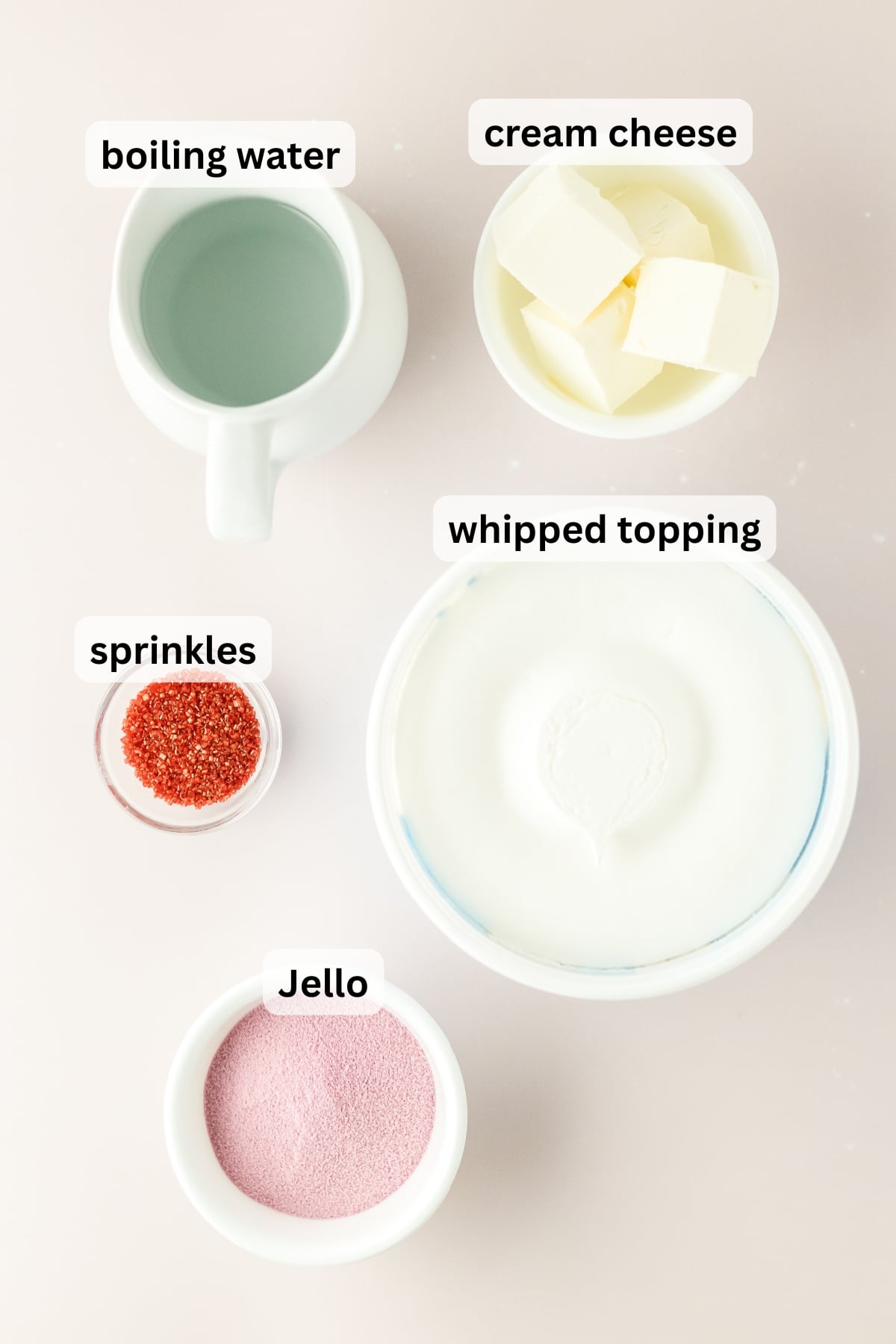 All of the ingredients necessary to make a Jello Parfait in bowls on a table