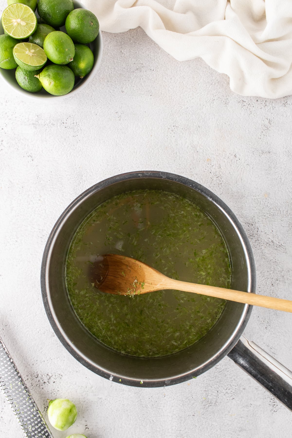 Lime juice, zest, water and sugar in a saucepan.