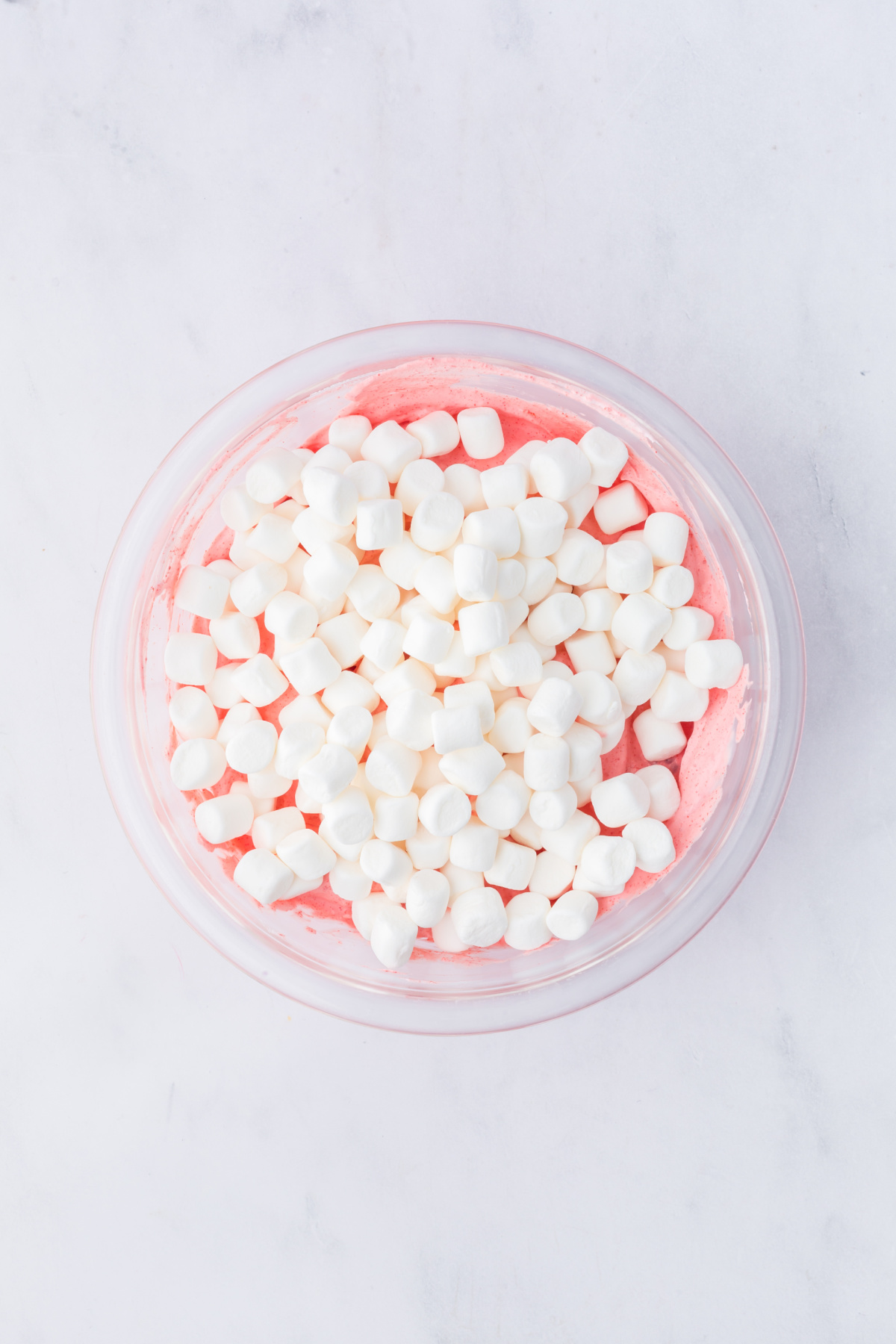 mini marshmallows folded into fluff in a bowl