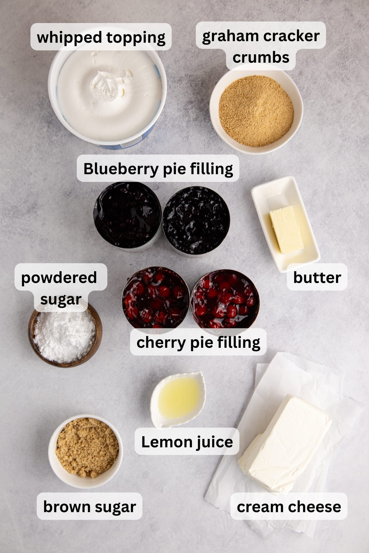 All of the ingredients needed to make Red White and Blue Berry Dessert in bowls on a table