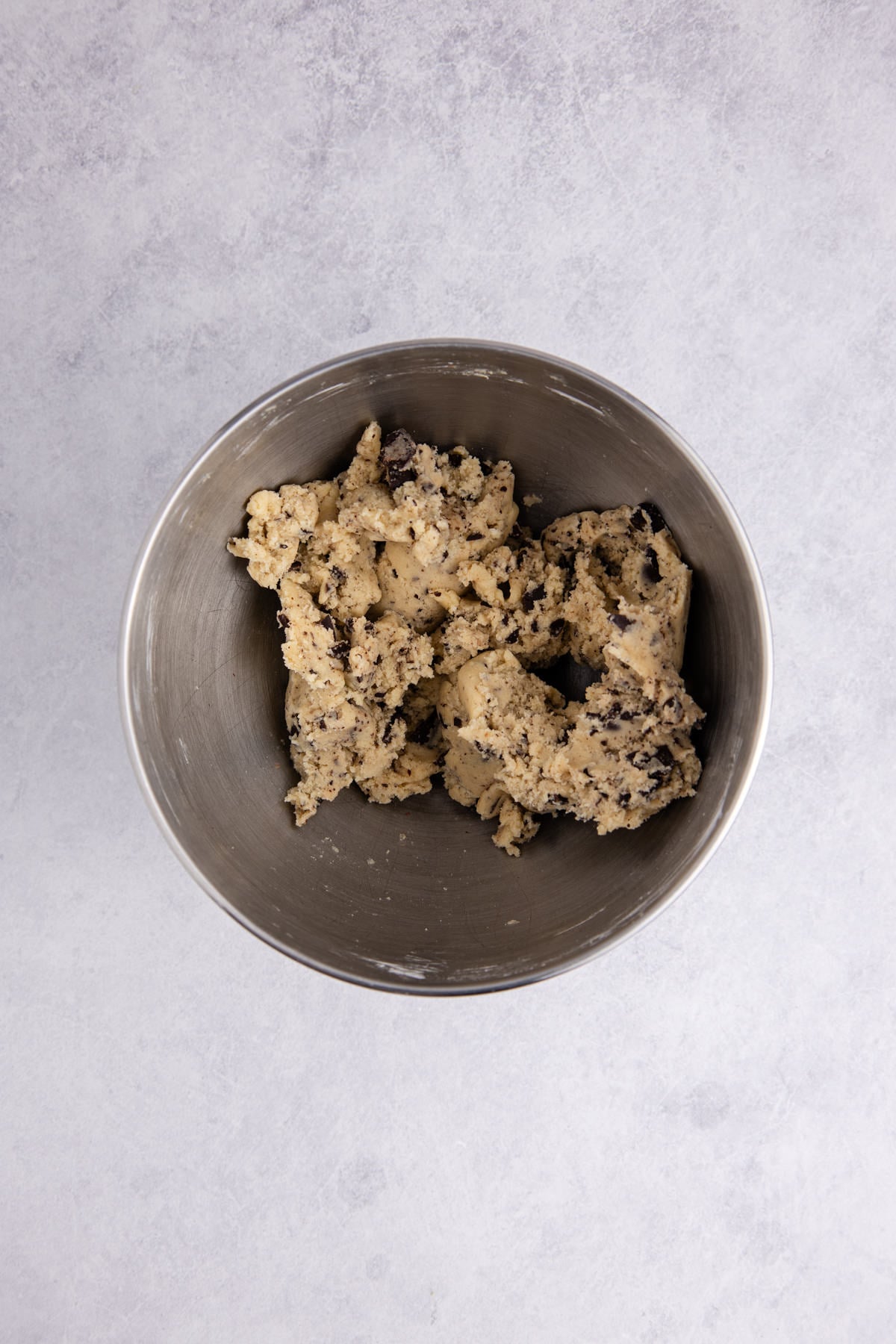 chocolate added to cookie dough in mixing bowl