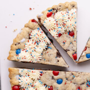 Red White and Blue Cookie Cake slices cut on a cutting board.