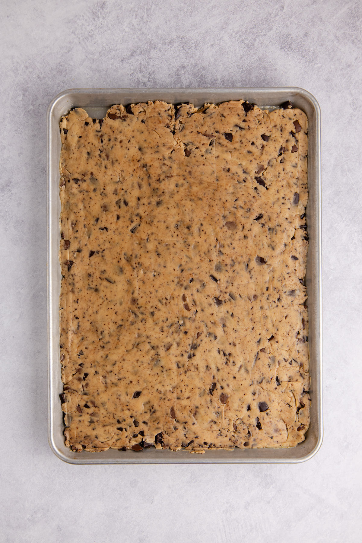 Cookie dough pressed into the pan