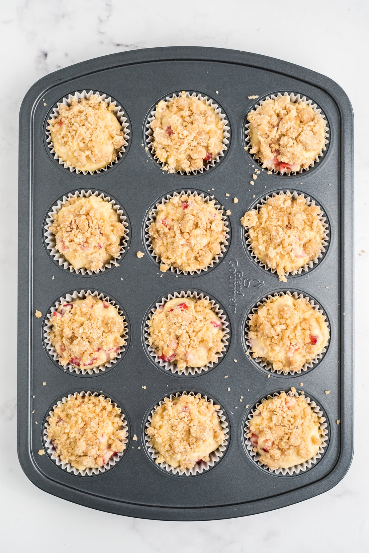 Streusel added on top of each muffin.