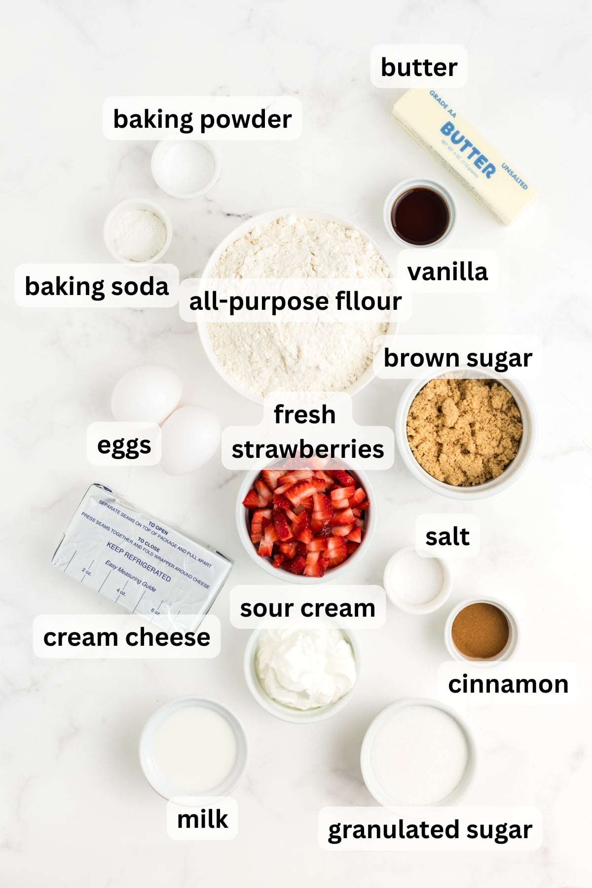 Ingredients to make these strawberry cream cheese muffins in bowls on a table.