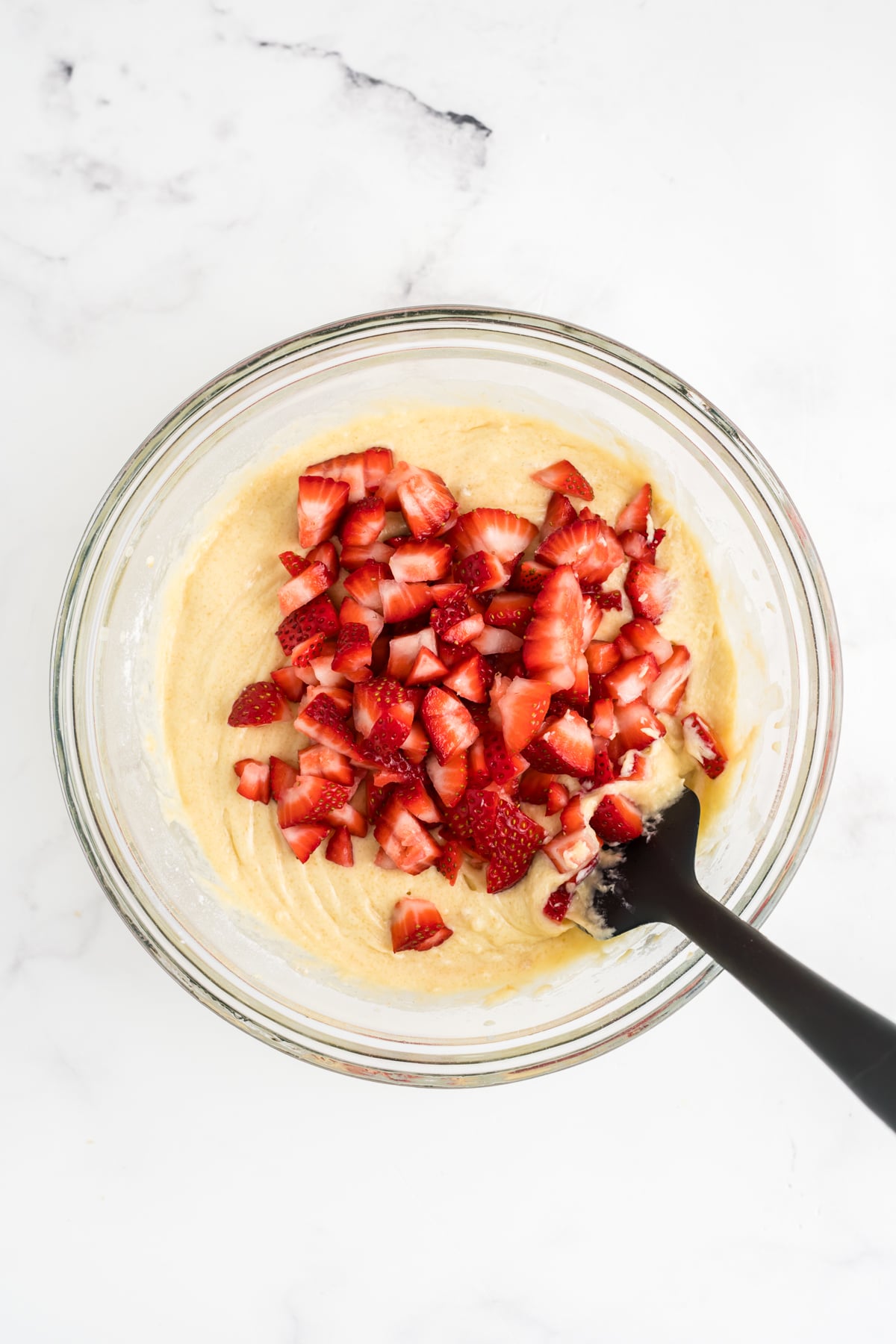 Strawberries added to the muffin batter. 