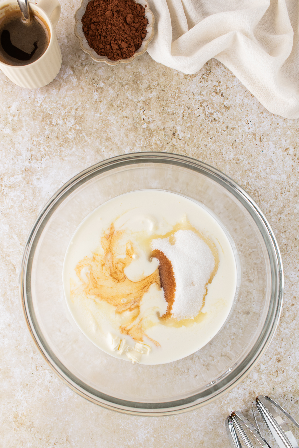 Mascarpone, cream, vanilla, and sugar in a mixing bowl.