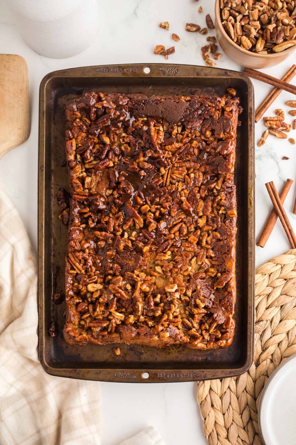 The pecan bread pudding cooling in a baking tray.