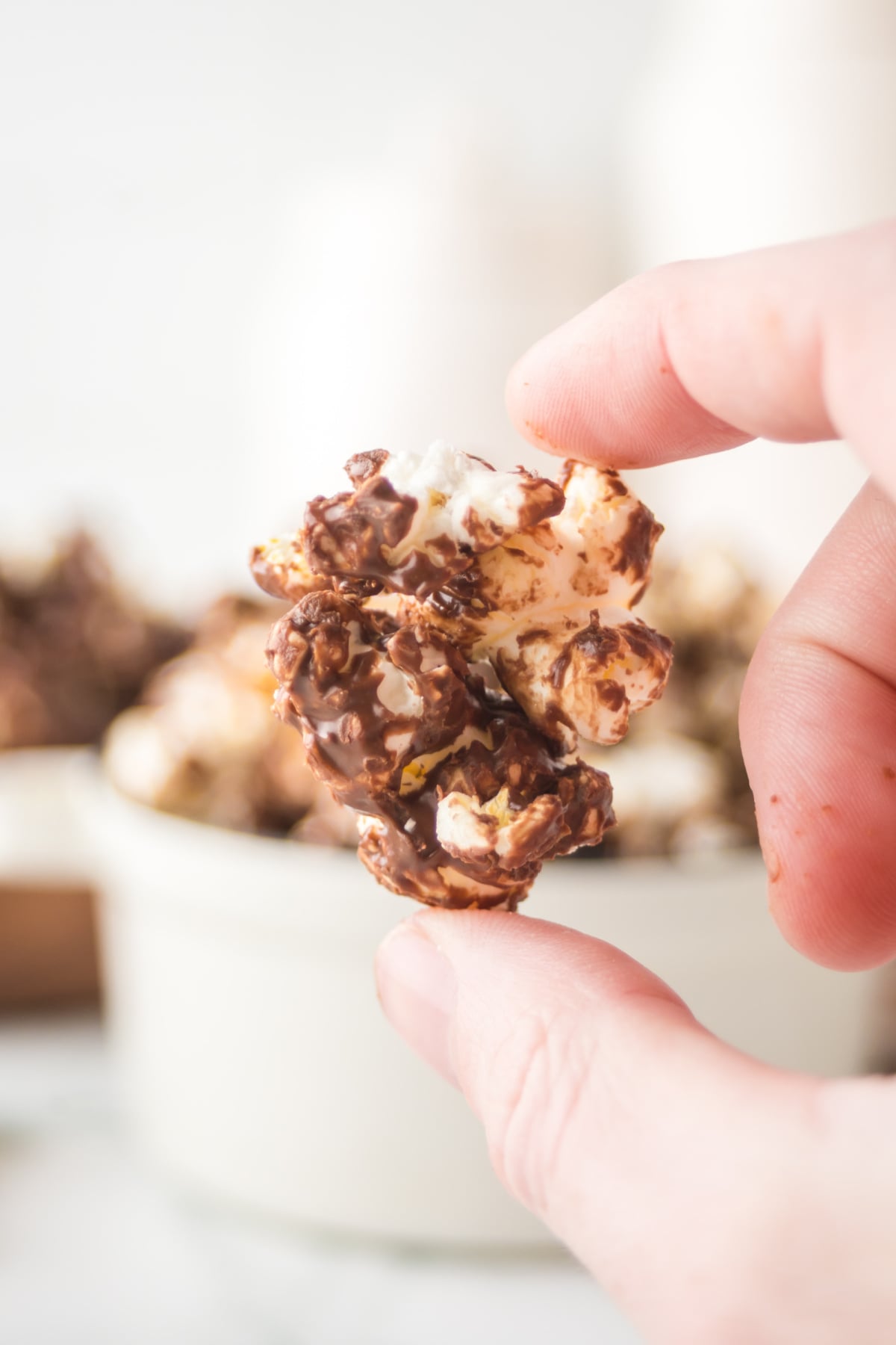 Popcorn piece held in the air