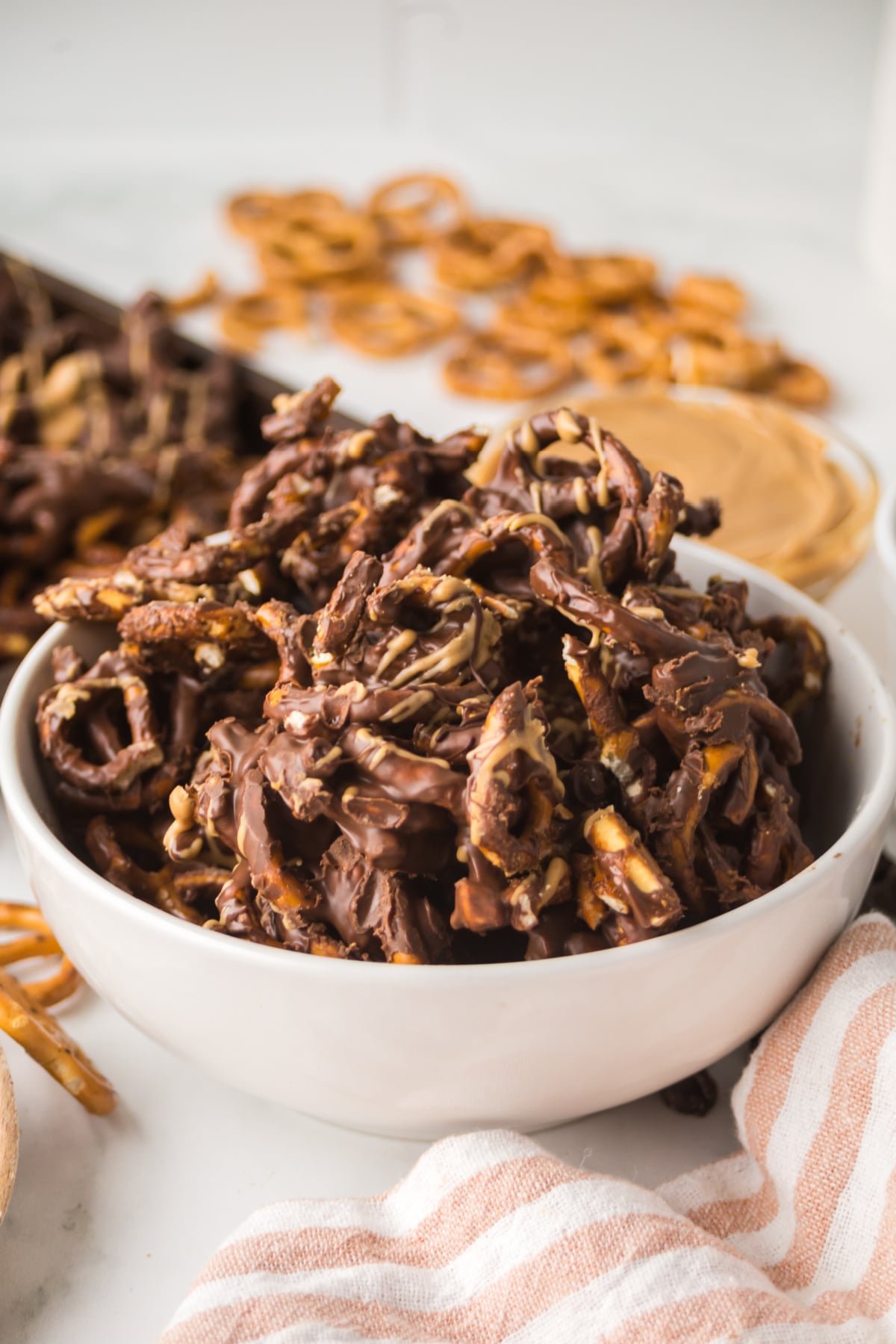 Pretzels piled high in a bowl on a table