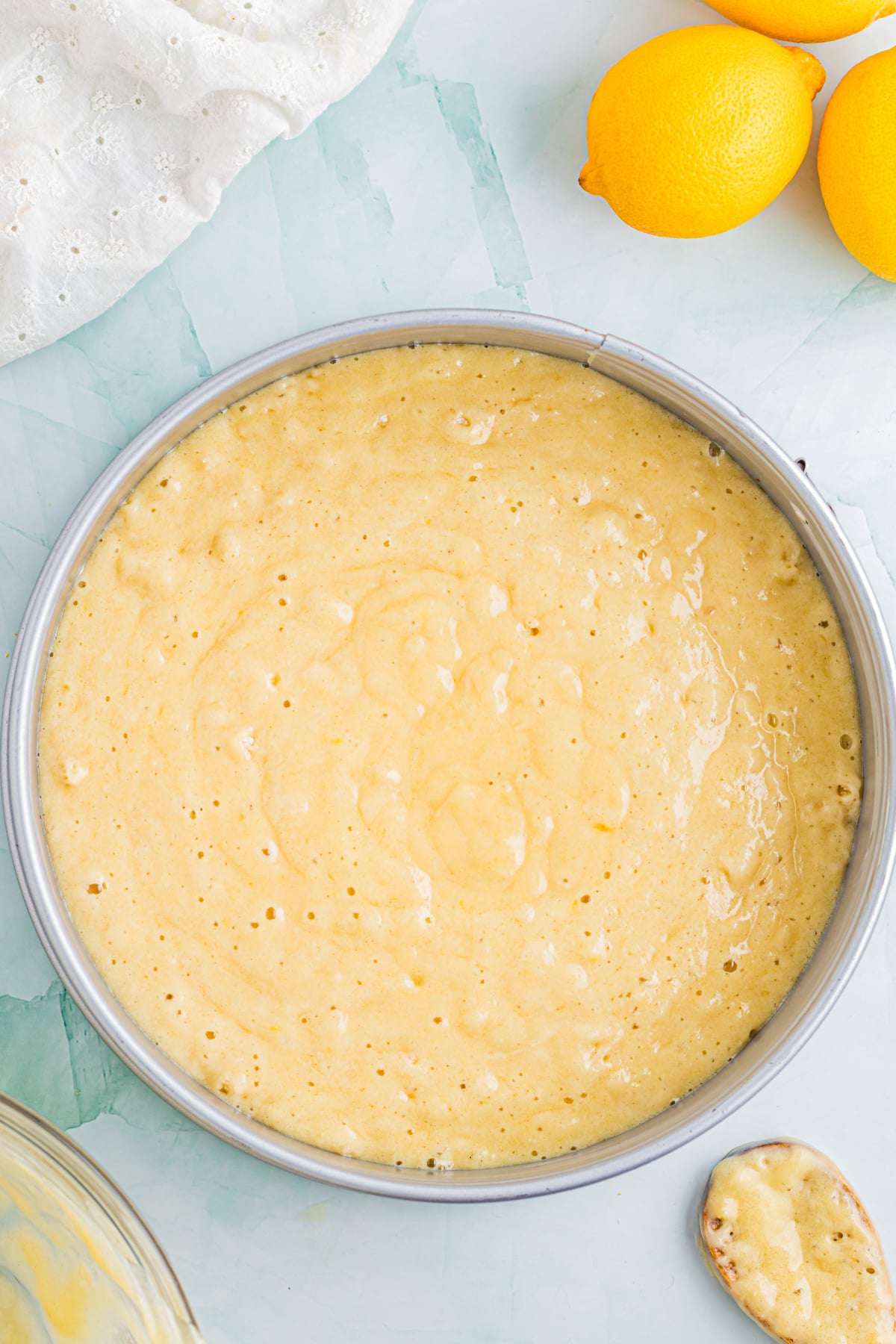 The batter in the prepared cake pan.