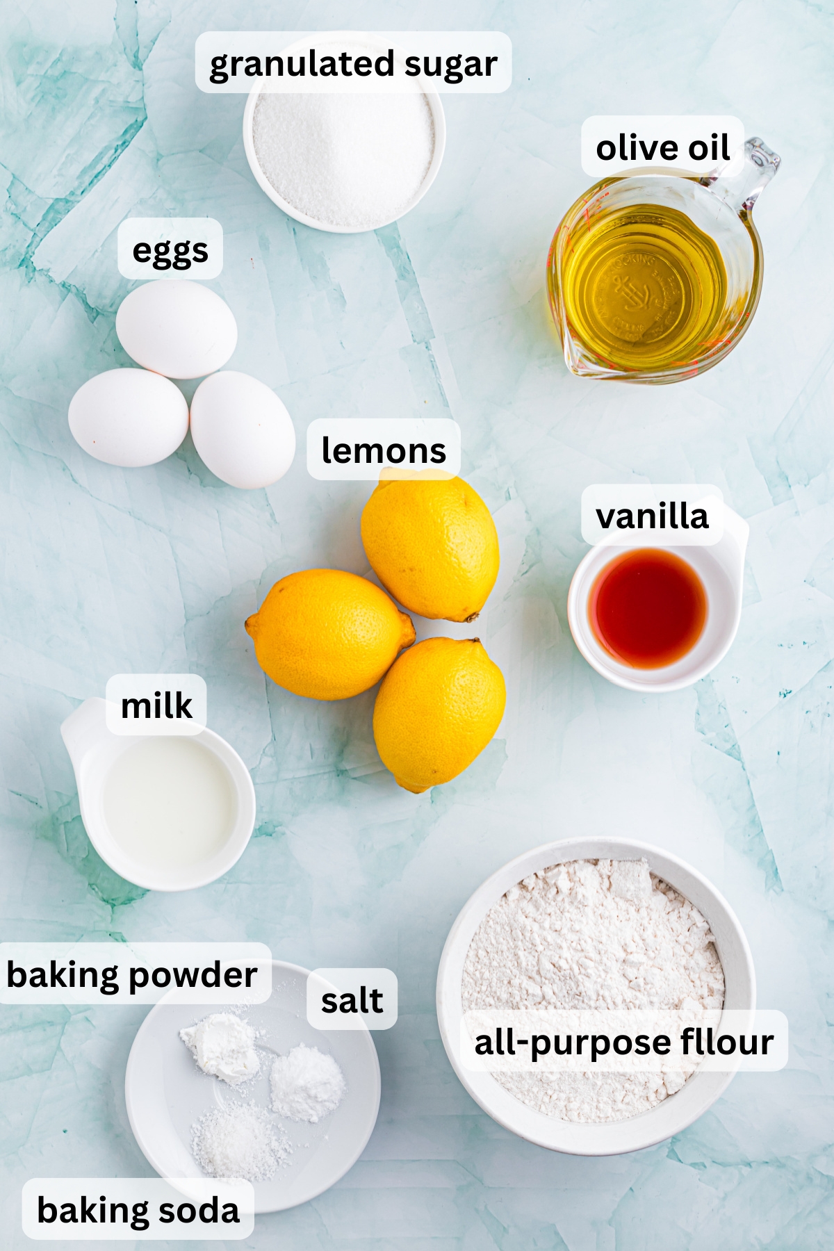 Ingredients to make this citrus olive oil cake on a table.